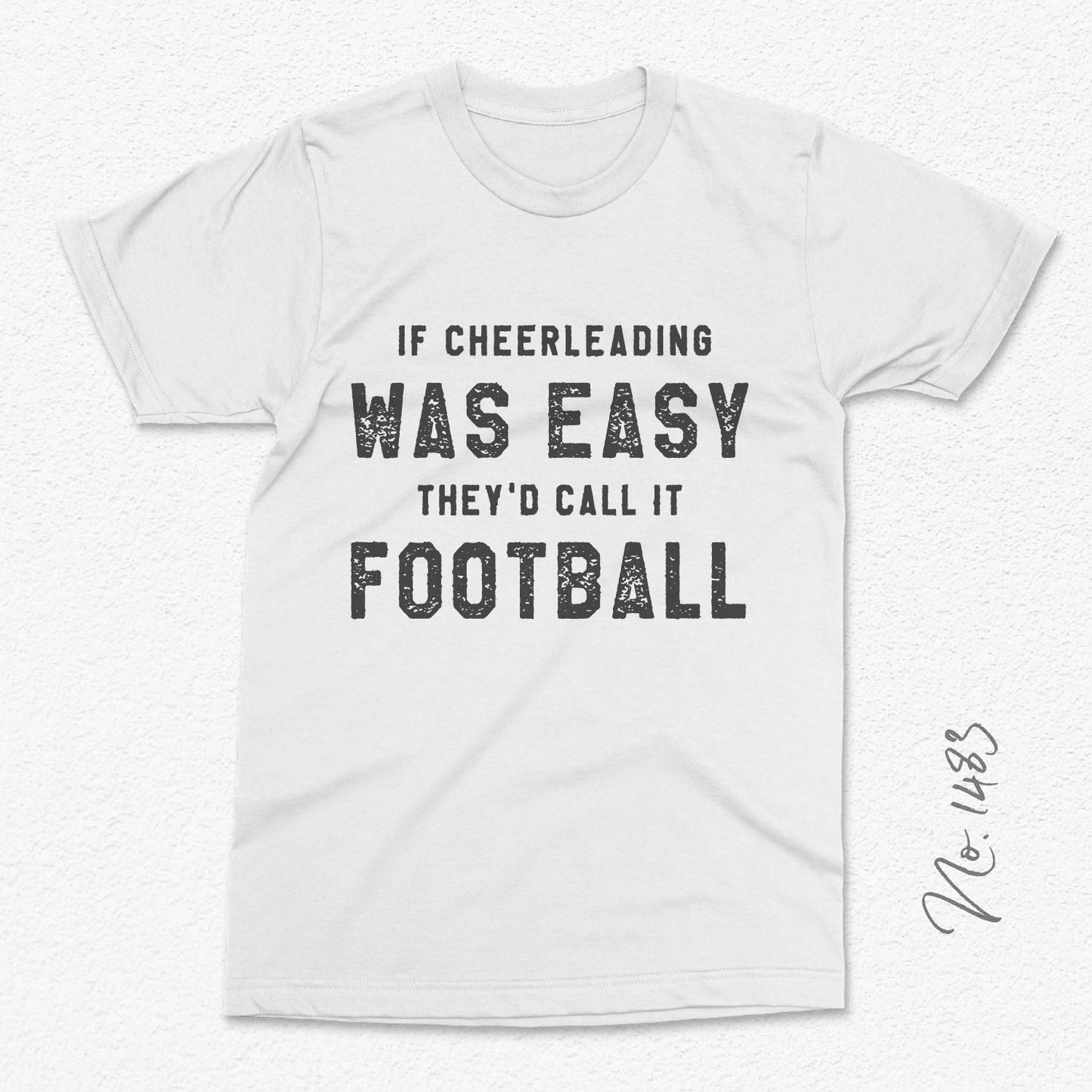 White t-shirt with funny cheerleading design text: 'If cheerleading was easy they'd call it football.'