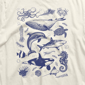 Vintage Ocean Life Shirt featuring orca, whale, dolphin, shark, octopus, turtle, and seahorse illustrations, made with breathable cotton.