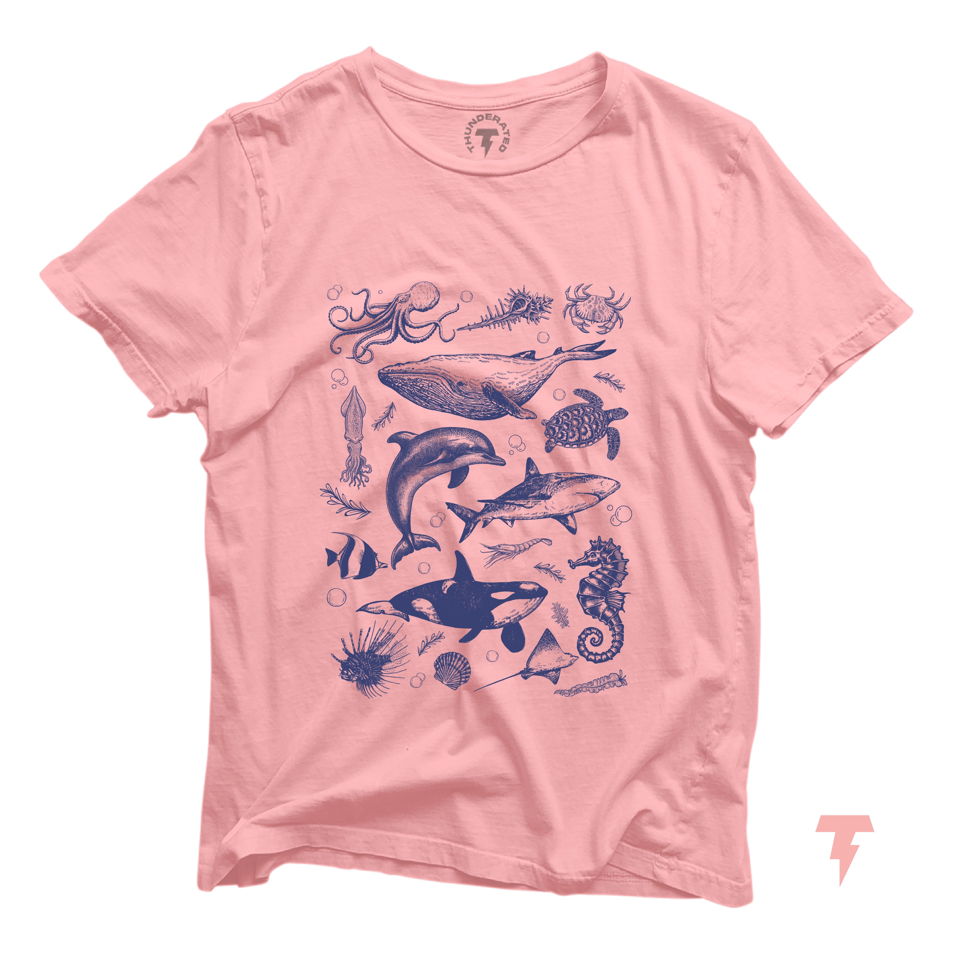 Pink T-shirt with vintage ocean wildlife illustrations featuring orca, whale, dolphin, and shark