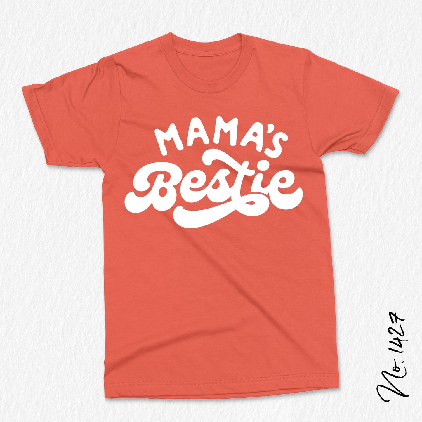 Red t-shirt with white 'Mama's Bestie' text, designed for baby and toddler apparel, ideal for custom shirts and gifts.