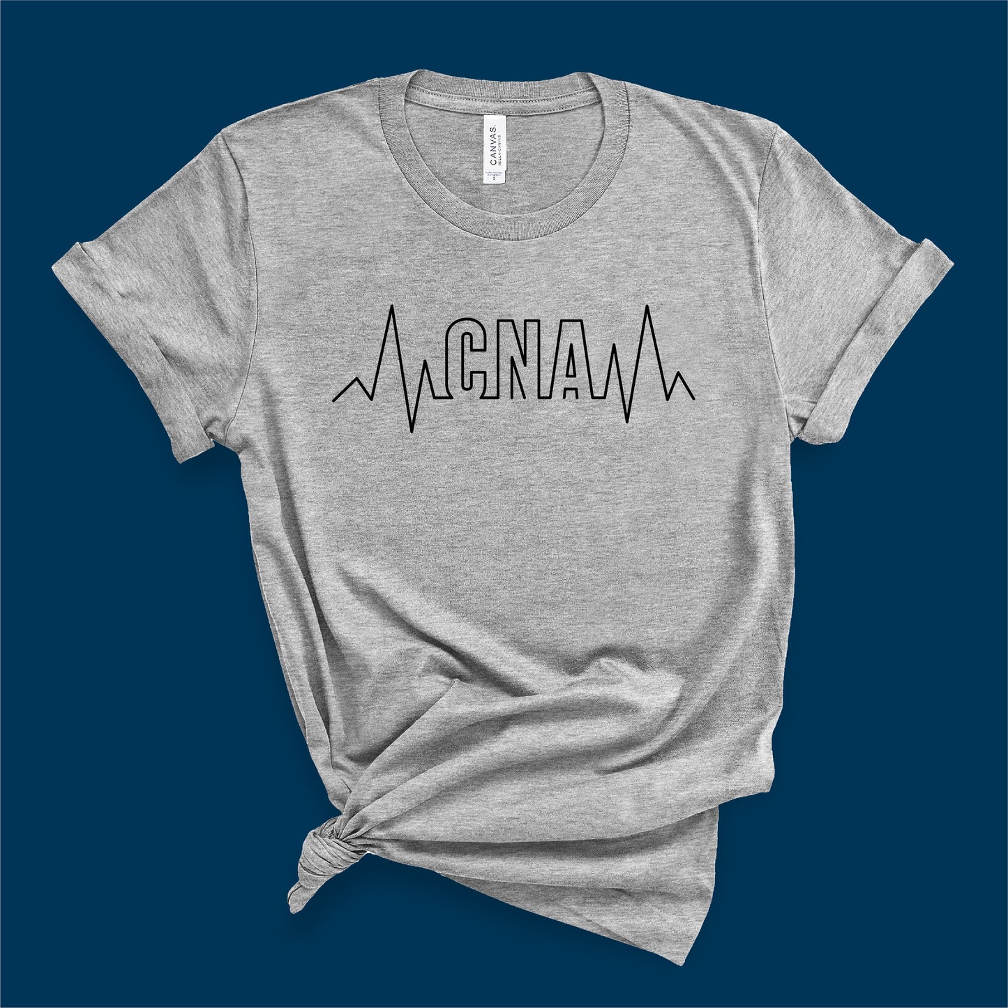 Gray t-shirt with 'CNA' and heartbeat line design, perfect for nursing assistants, available as SVG for Cricut and Silhouette.
