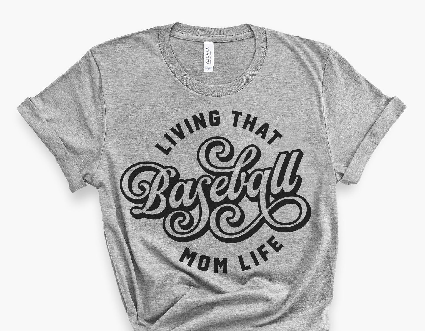 Gray t-shirt with 'Living That Baseball Mom Life' design in vintage script style, perfect for baseball fan apparel.