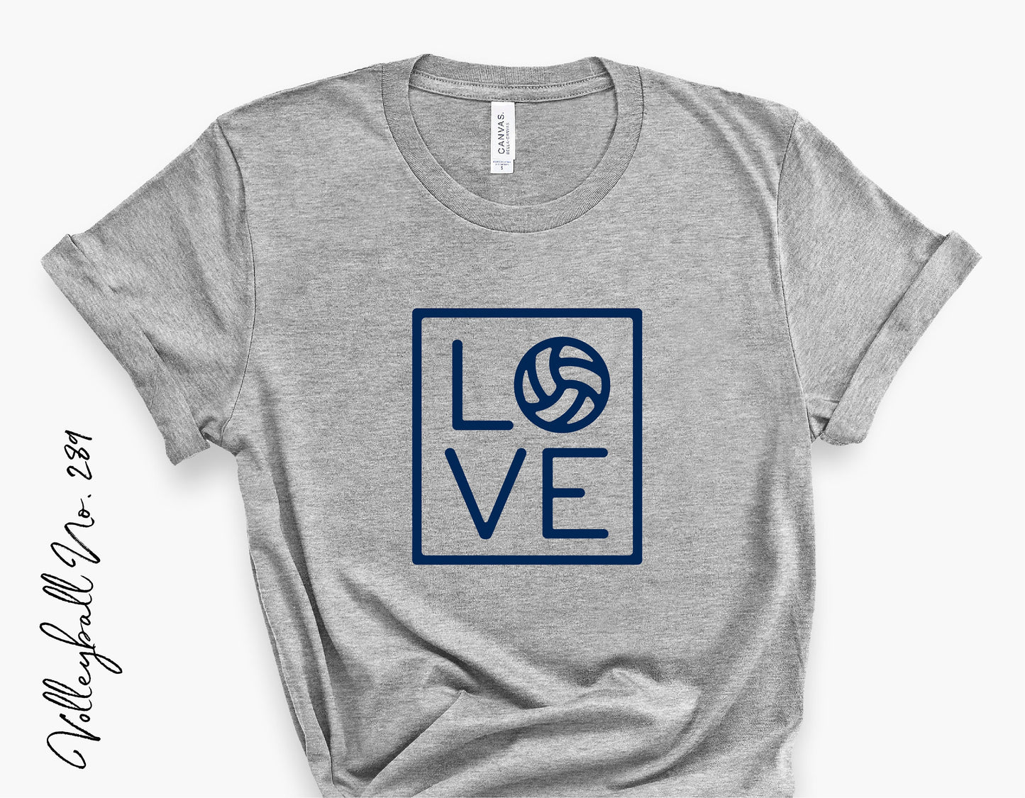 Gray T-shirt featuring a navy blue volleyball-themed 'LOVE' design, ideal for volleyball team supporters and Cricut projects.