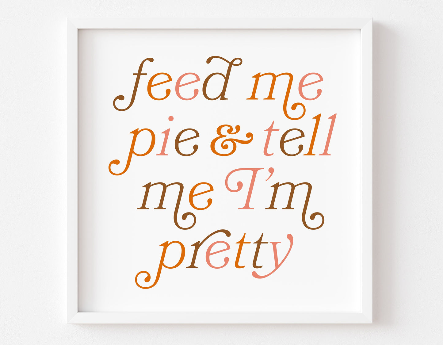 "Feed Me Pie and Tell Me I'm Pretty" autumn-themed typography in a white frame, perfect for Thanksgiving or fall decor.