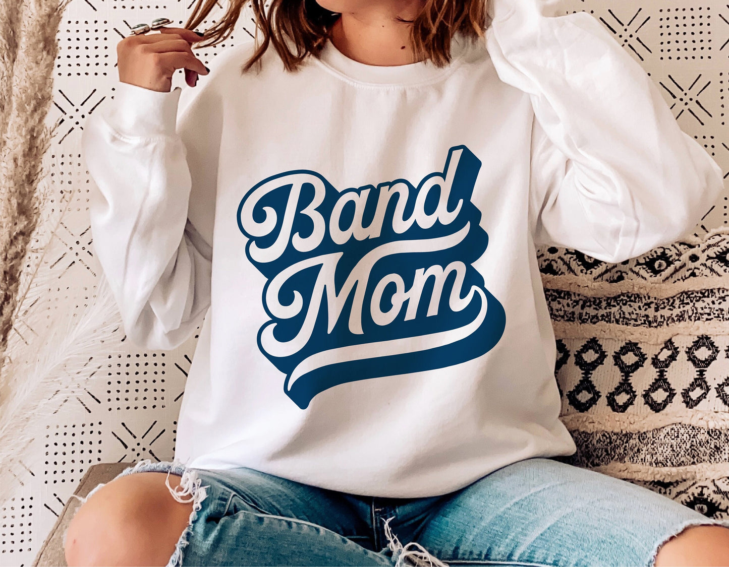 White Band Mom sweatshirt styled with blue jeans, perfect for school spirit and marching band enthusiasts, featuring bold lettering.