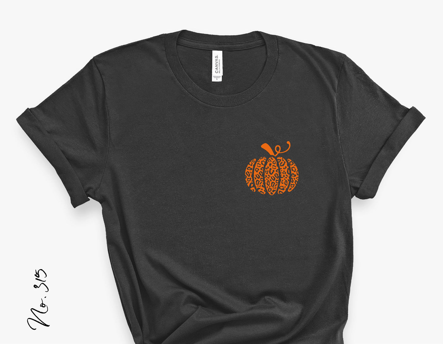 Black t-shirt featuring an orange leopard-patterned pumpkin design on the front, perfect for fall or Halloween.