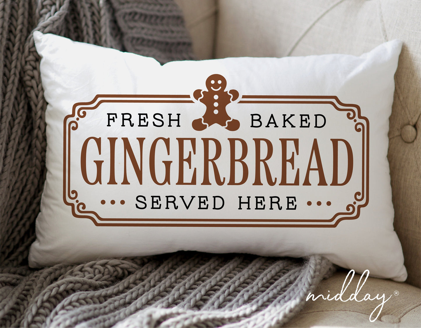 Decorative pillow featuring a gingerbread man with text 'Fresh Baked Gingerbread Served Here' on a couch.