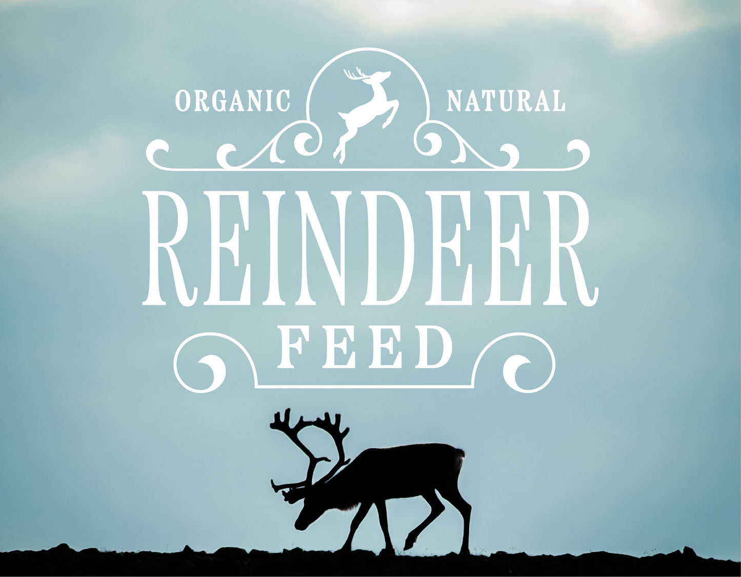 Silhouette of reindeer with "Organic Natural Reindeer Feed" text overlay against cloudy sky background.