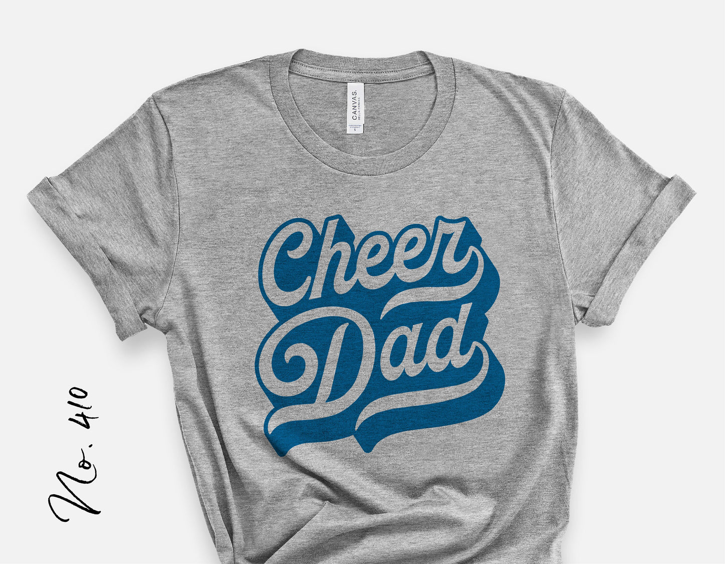 Gray t-shirt with blue 'Cheer Dad' text design, ideal for cheerleading team supporters, available for cut file download.