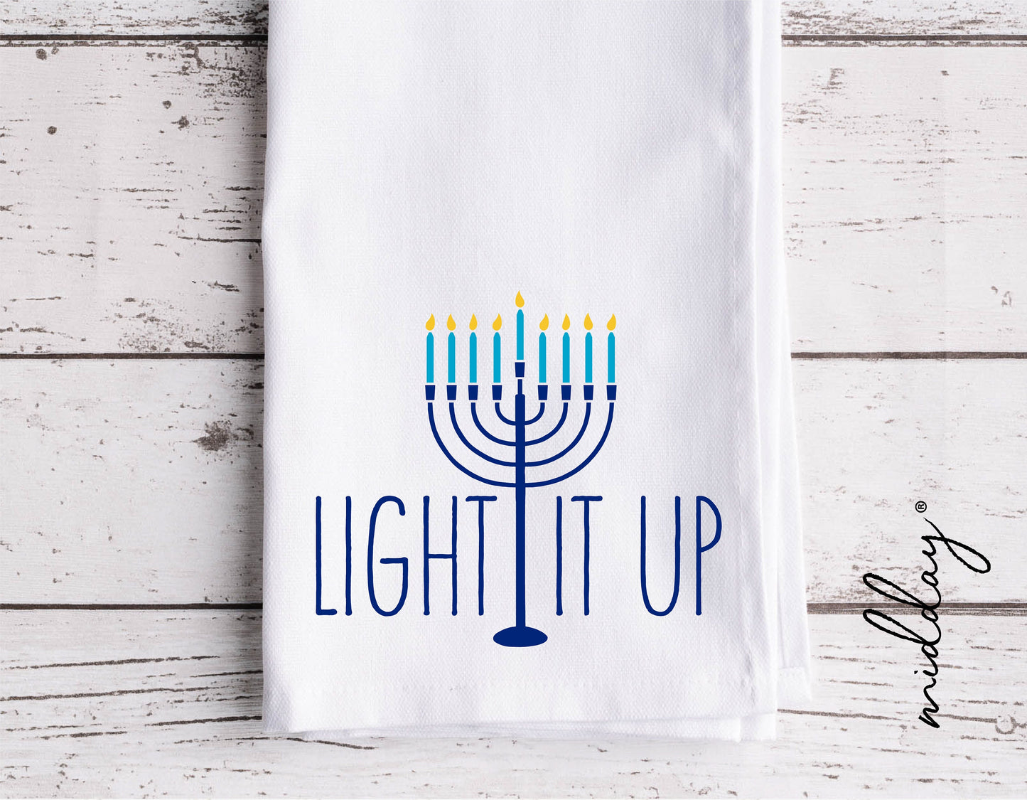 Light It Up Menorah design on a white towel for Hanukkah decor, featuring candles and text in blue. Ideal for Cricut and Silhouette projects.