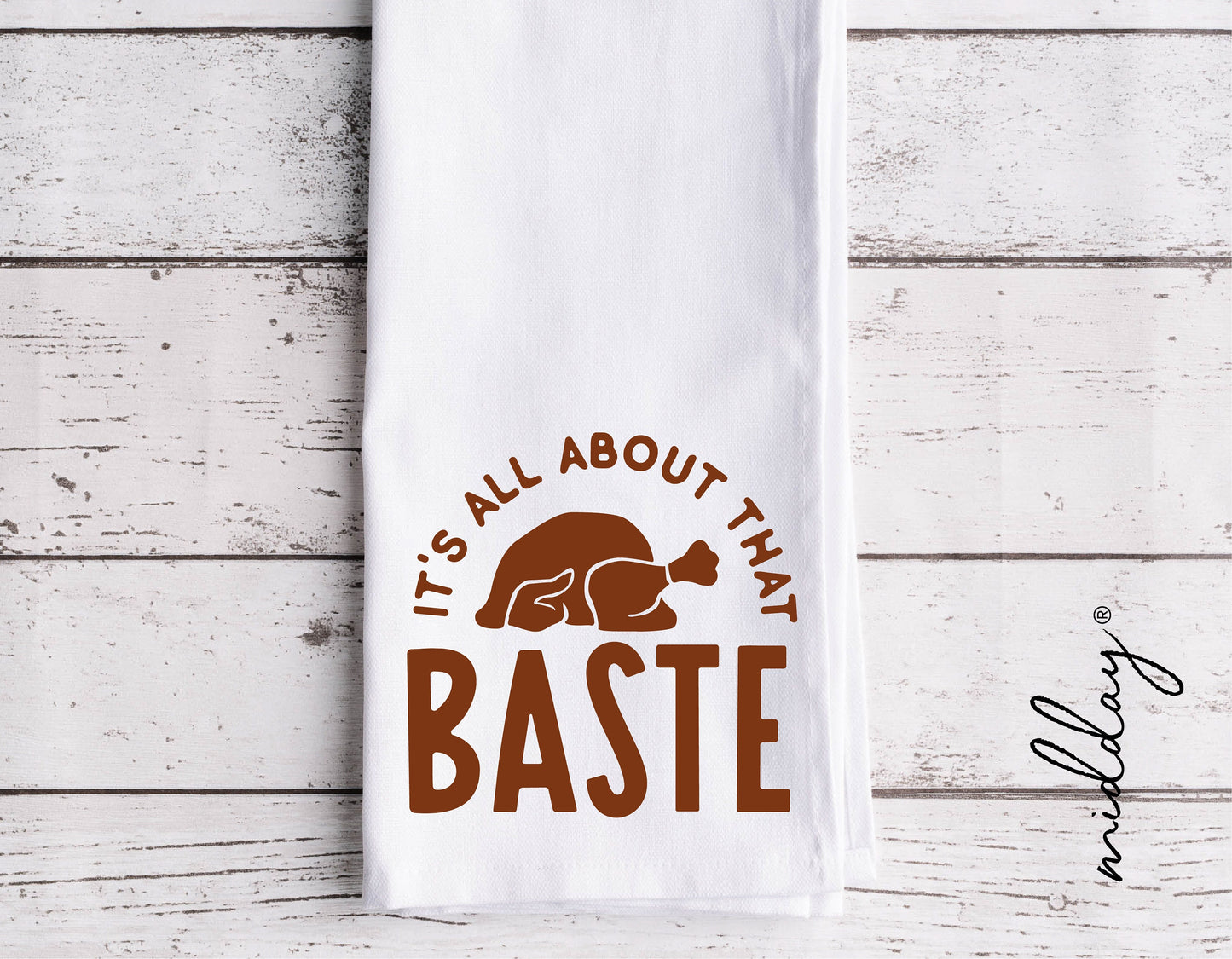 "It's All About That Baste" turkey design on a white kitchen towel for Thanksgiving decor.