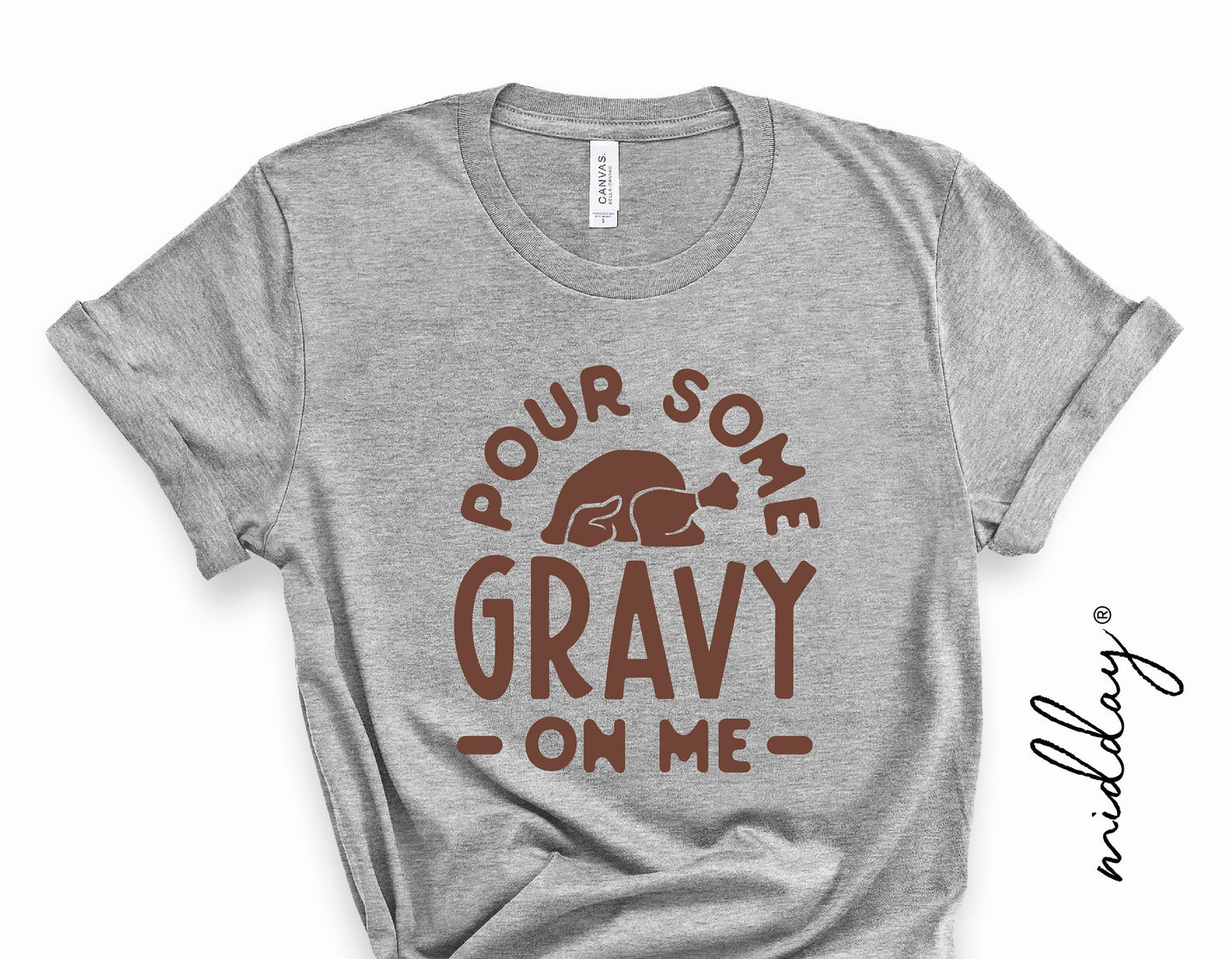 Gray t-shirt with 'Pour Some Gravy On Me' and turkey graphic, perfect for funny Thanksgiving and fall-themed cricut projects.