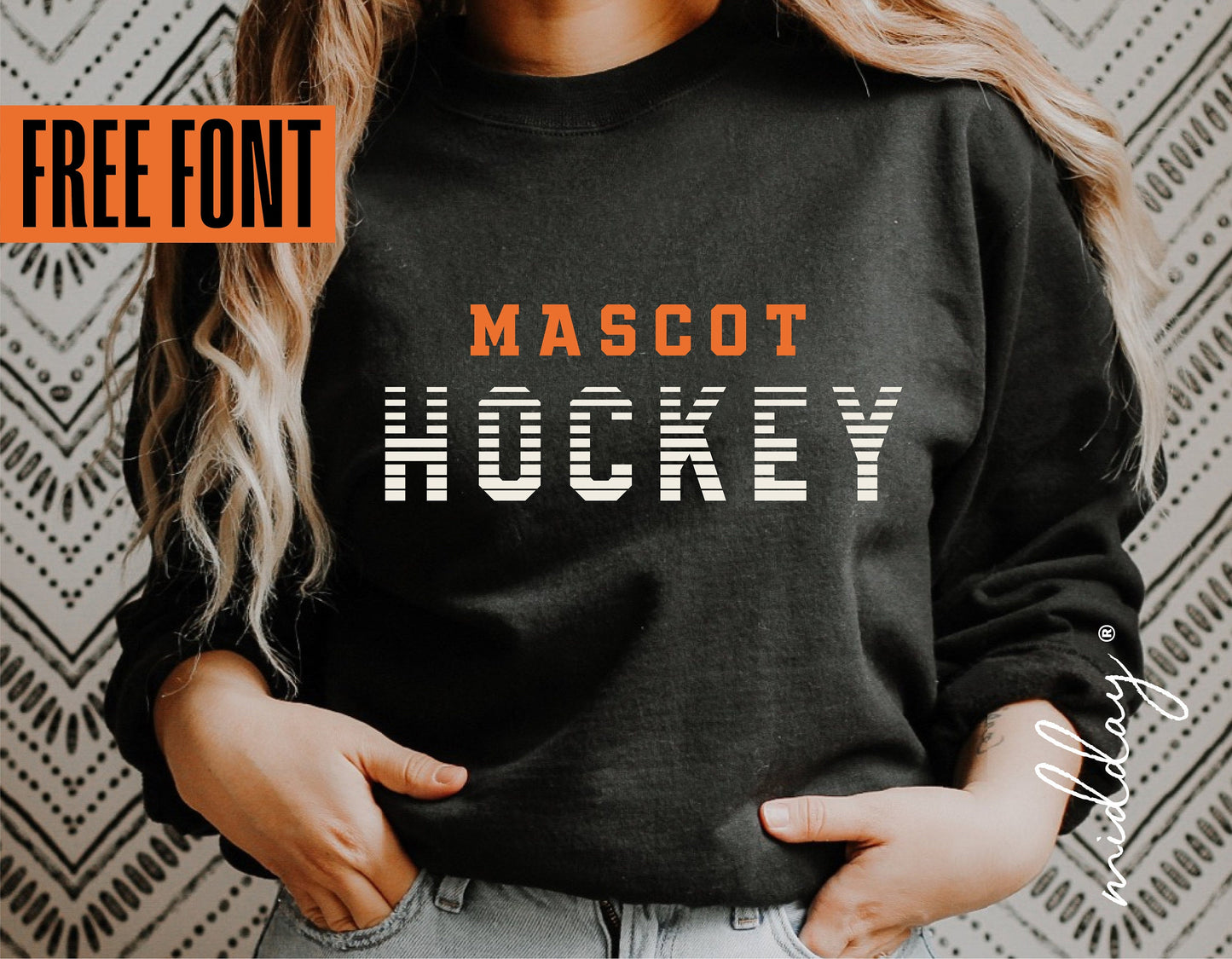 Person wearing a black sweatshirt with 'Mascot Hockey' text, showcasing free font design under a geometric background.
