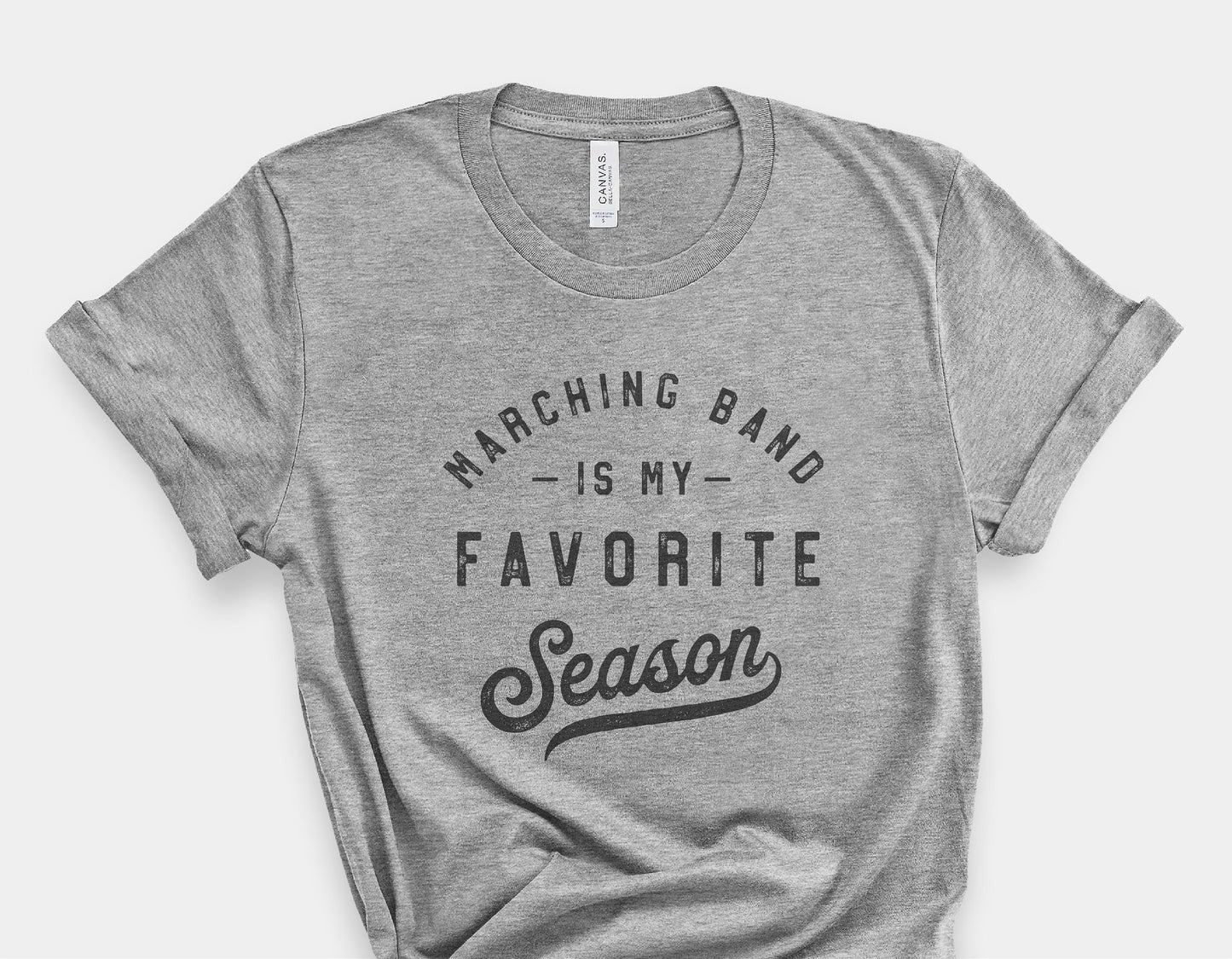 Gray t-shirt with 'Marching Band is My Favorite Season' slogan, ideal for band enthusiasts, available in SVG, PNG, and more Cricut formats.