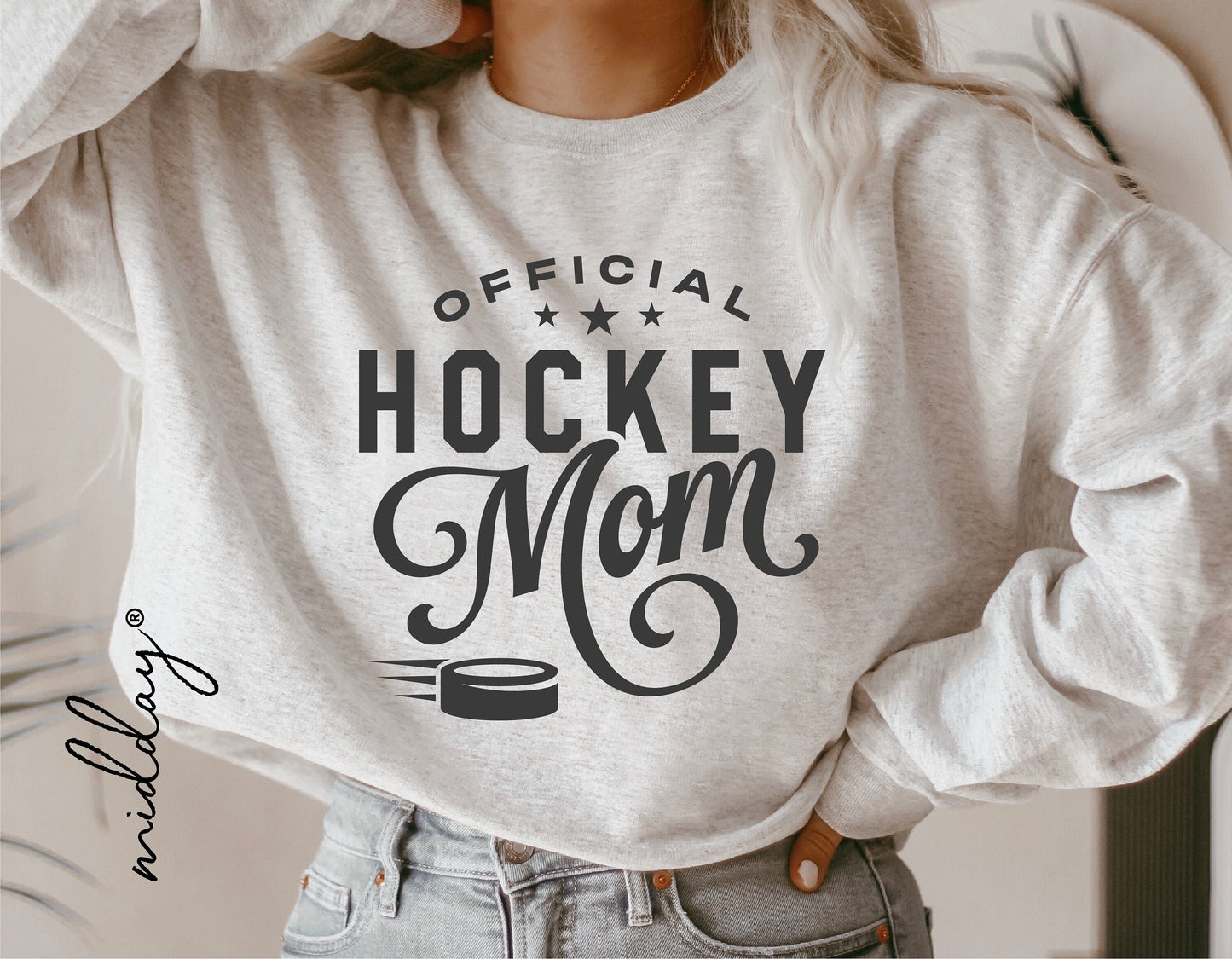 Gray sweatshirt featuring 'Official Hockey Mom' design, ideal for hockey enthusiasts, suitable for Cricut and Silhouette projects.