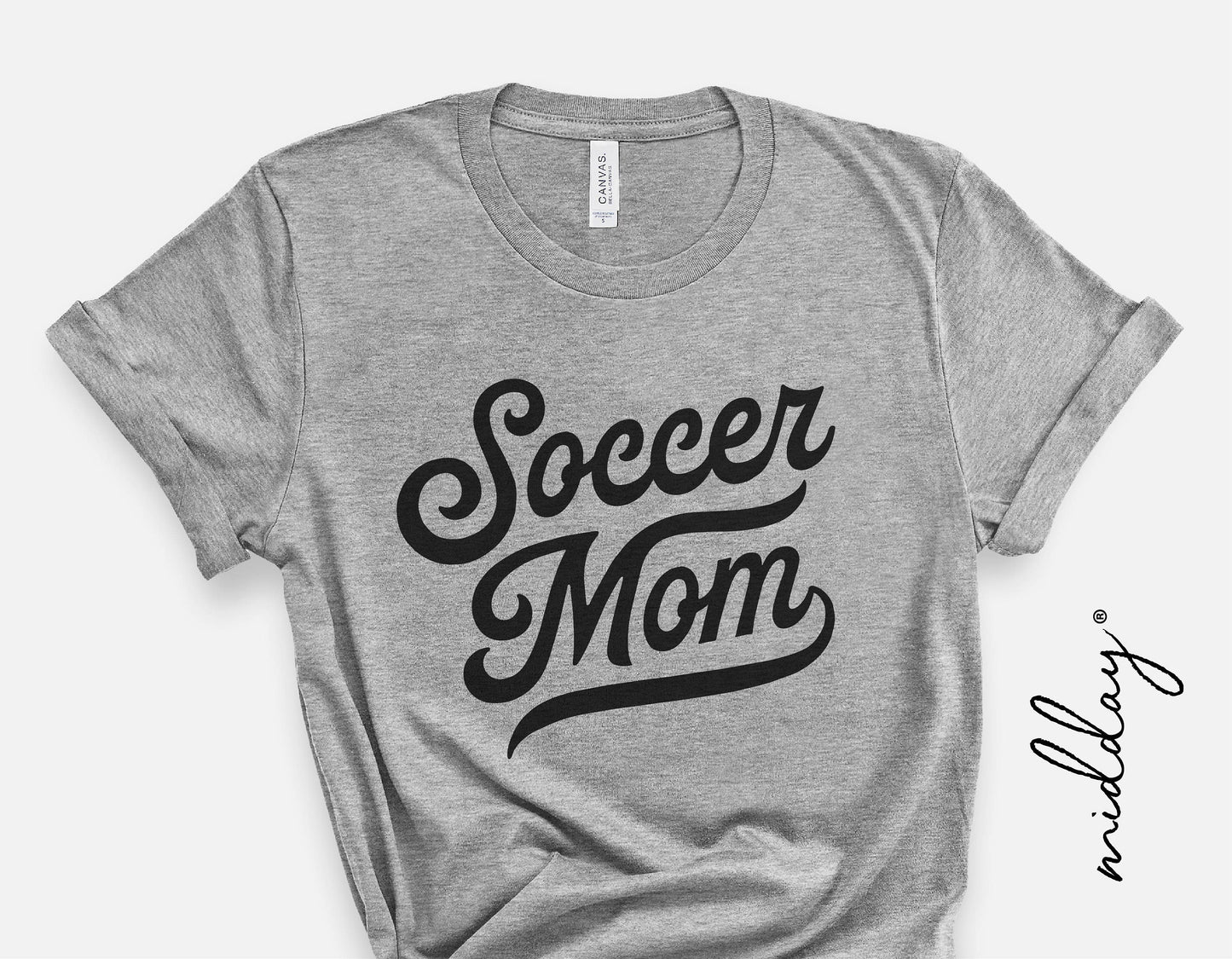 Gray t-shirt with vintage 'Soccer Mom' print, perfect for soccer fans and youth sports, available in SVG PNG for Cricut sublimation.