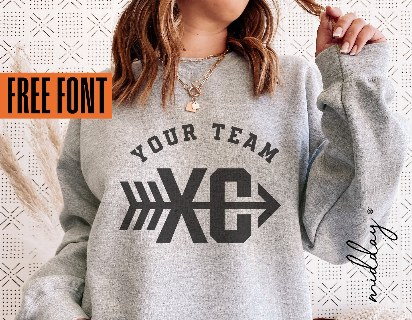 Woman wearing a gray sweatshirt with 'Your Team XC' and arrow design, showcasing cross country motif and free font offer.