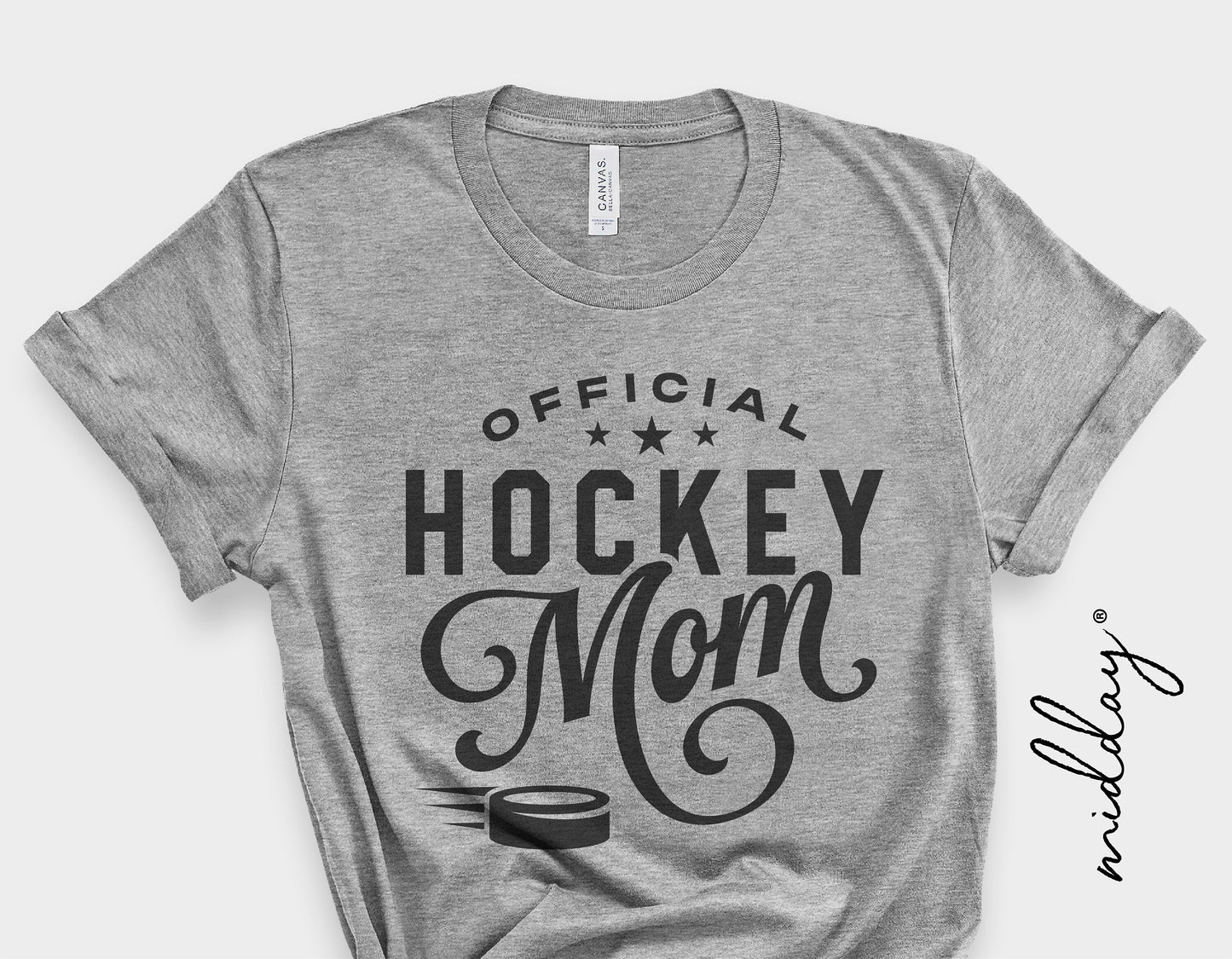 Gray t-shirt with 'Official Hockey Mom' design featuring stars and a hockey puck graphic.