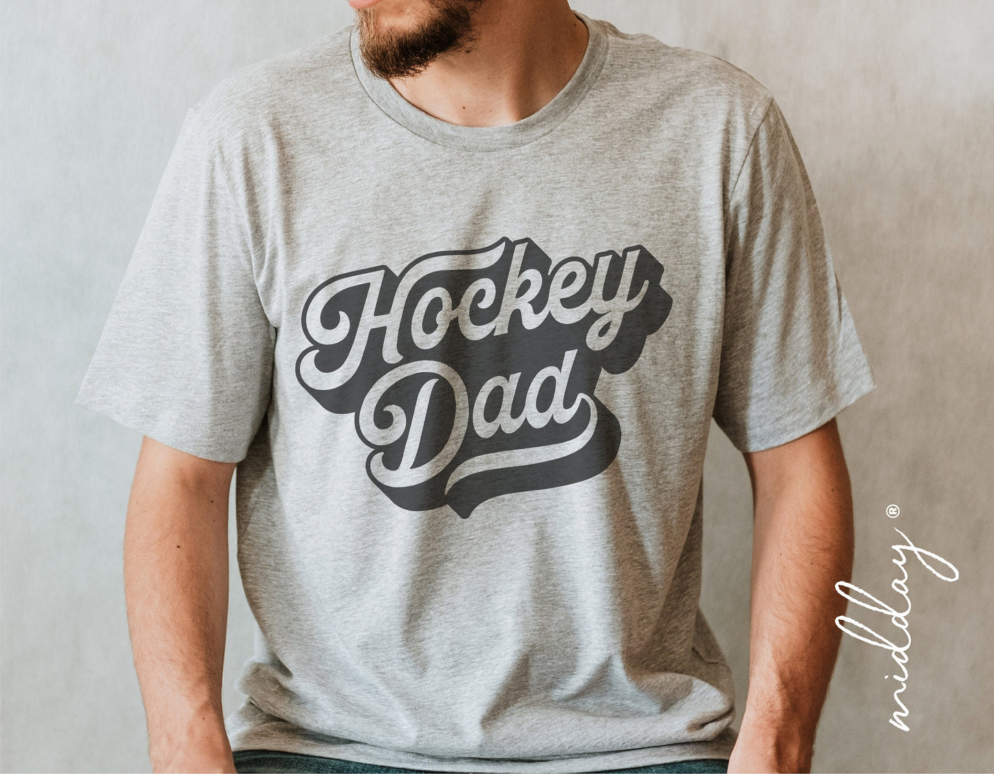 Man wearing grey 'Hockey Dad' t-shirt, perfect for hockey fans and dads, sports apparel.