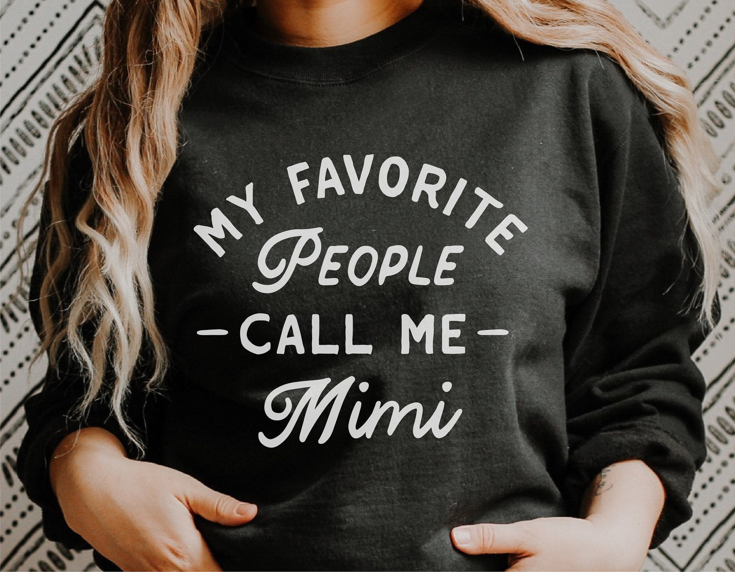 Woman wearing black shirt with 'My Favorite People Call Me Mimi' text, perfect for grandma gift, Mother's Day Cricut DIY projects.