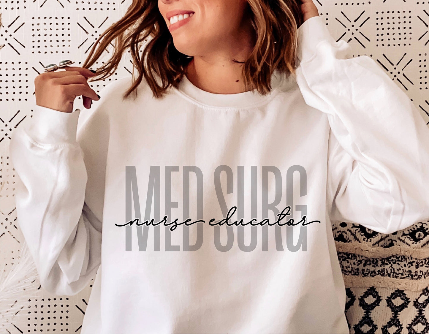 Woman wearing white sweatshirt with 'Med Surg Nurse Educator' text design, ideal for healthcare professionals. Cricut and Silhouette cut file.