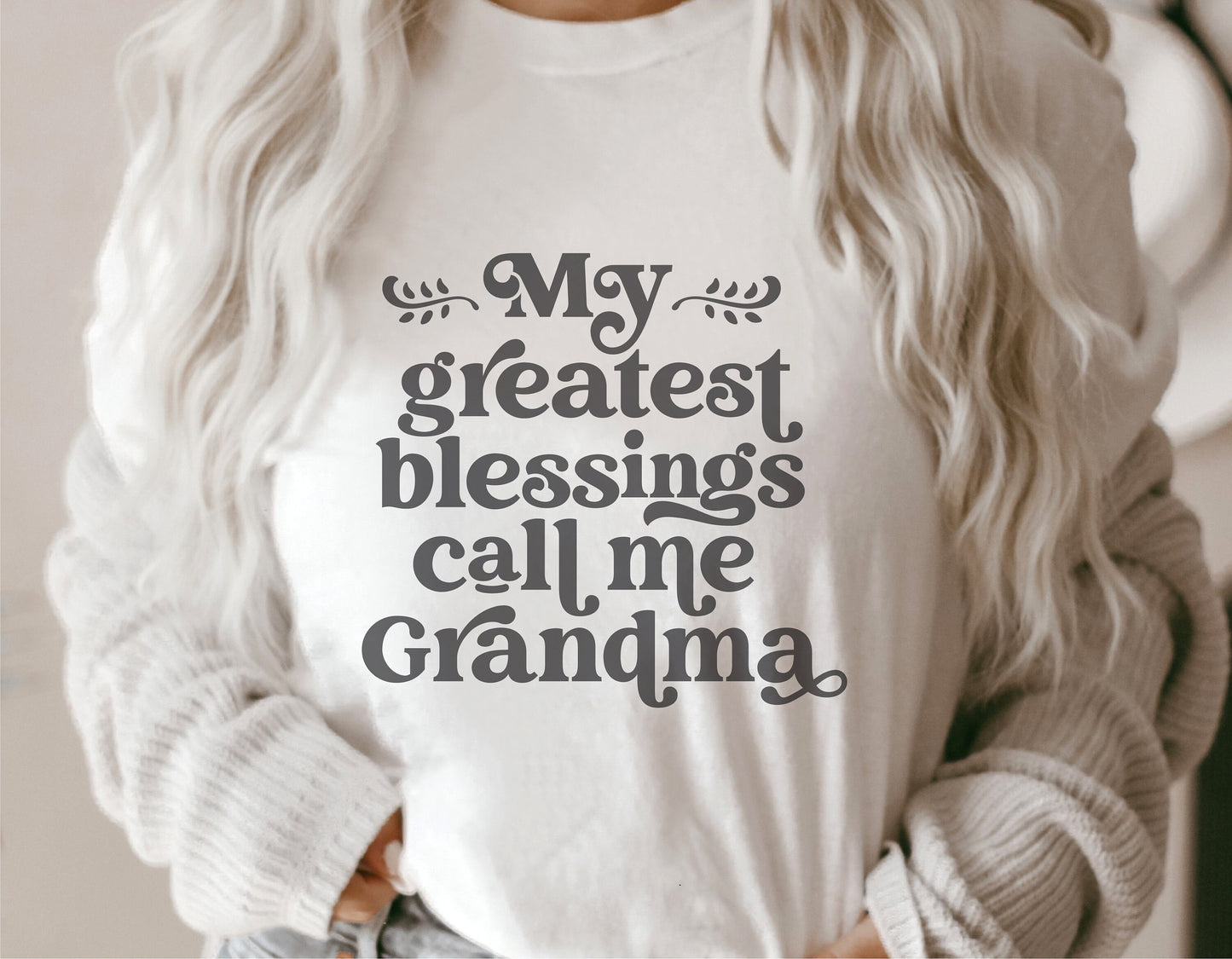 White t-shirt with 'My Greatest Blessings Call Me Grandma' print, perfect for Mother's Day, featuring stylish text design.