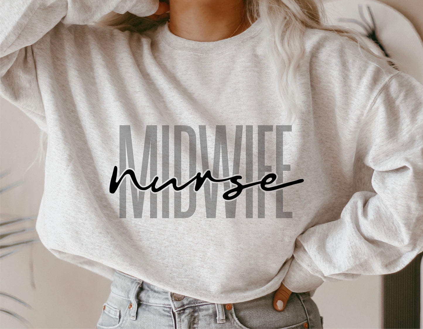Woman wearing a grey sweatshirt with 'Midwife Nurse' text, suitable for midwife-themed Cricut and Silhouette designs.