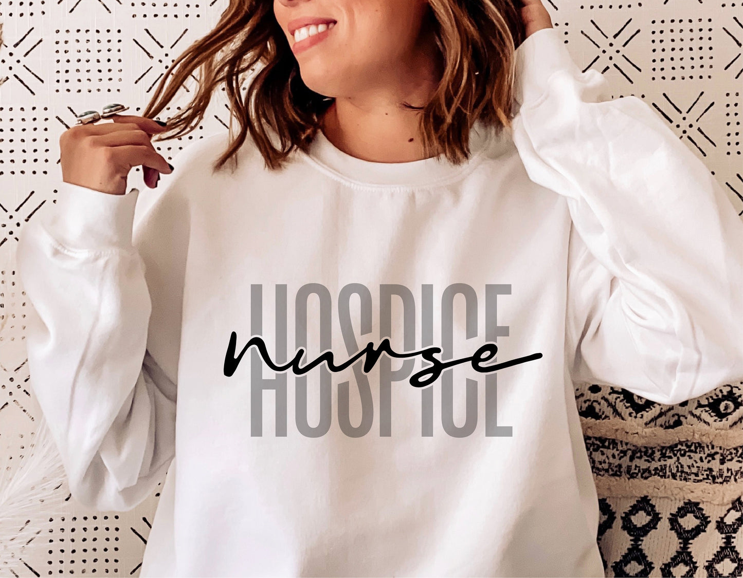 Woman wearing white sweater with 'Hospice Nurse' design, suitable for Cricut and Silhouette cutting machines. Digital download available.