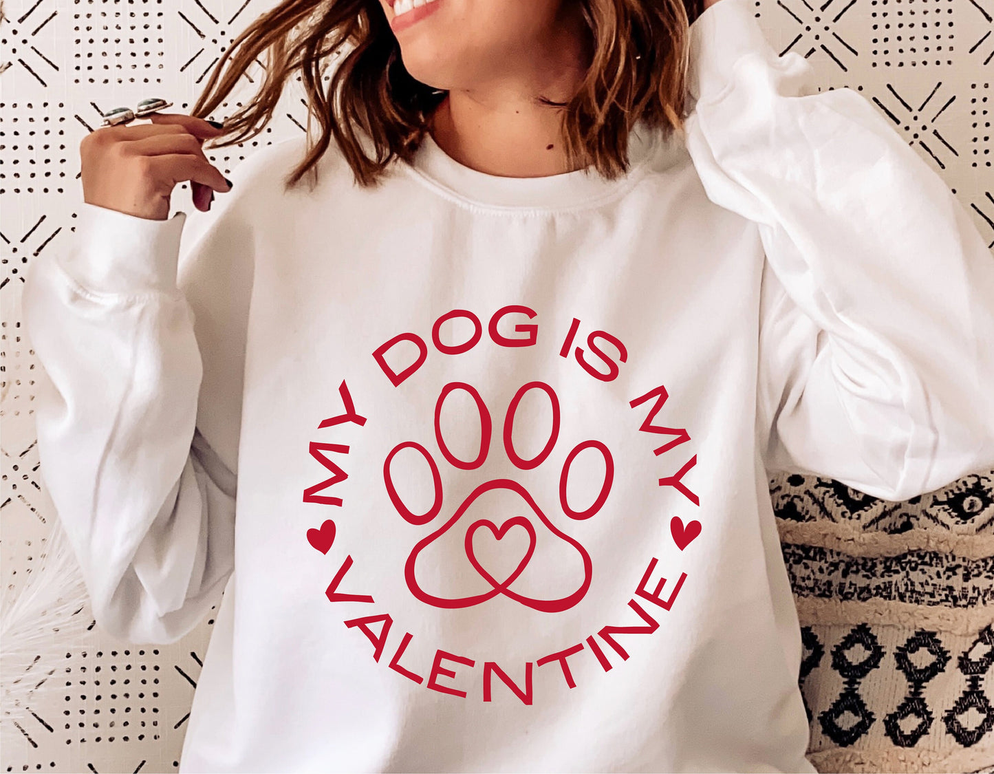 Woman wearing a sweatshirt with 'My Dog is My Valentine' message and red paw print design, perfect for dog lovers on Valentine's Day.