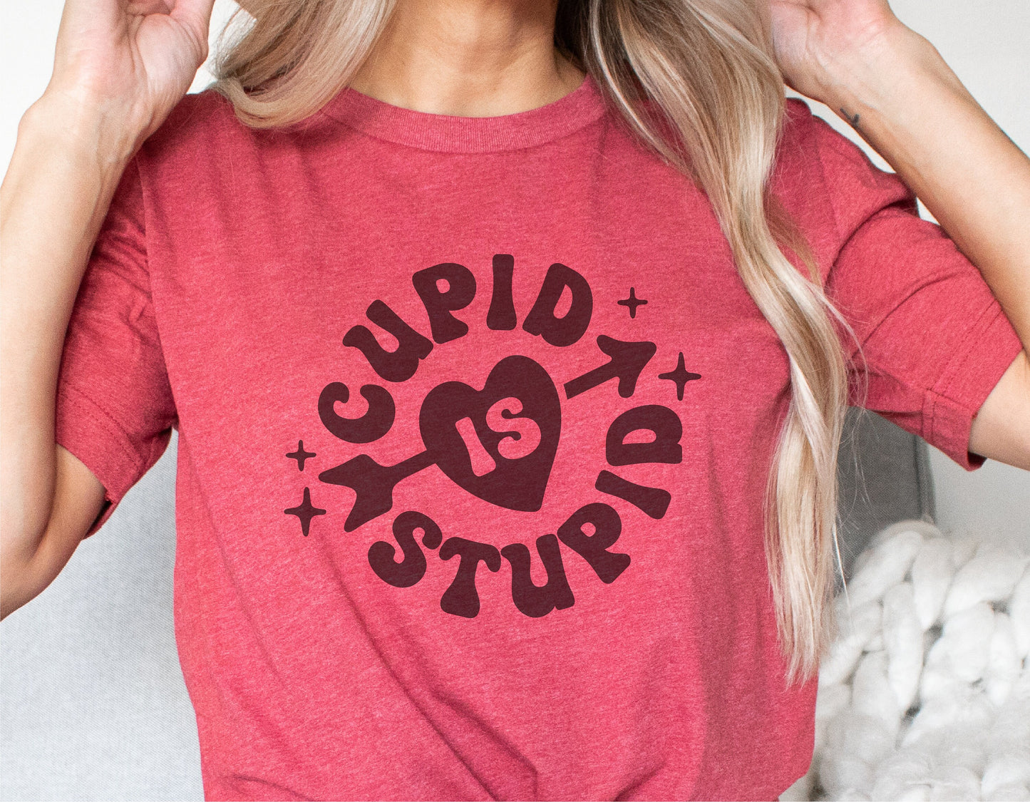Red t-shirt with quirky 'Cupid is Stupid' design for Valentine's Day humor