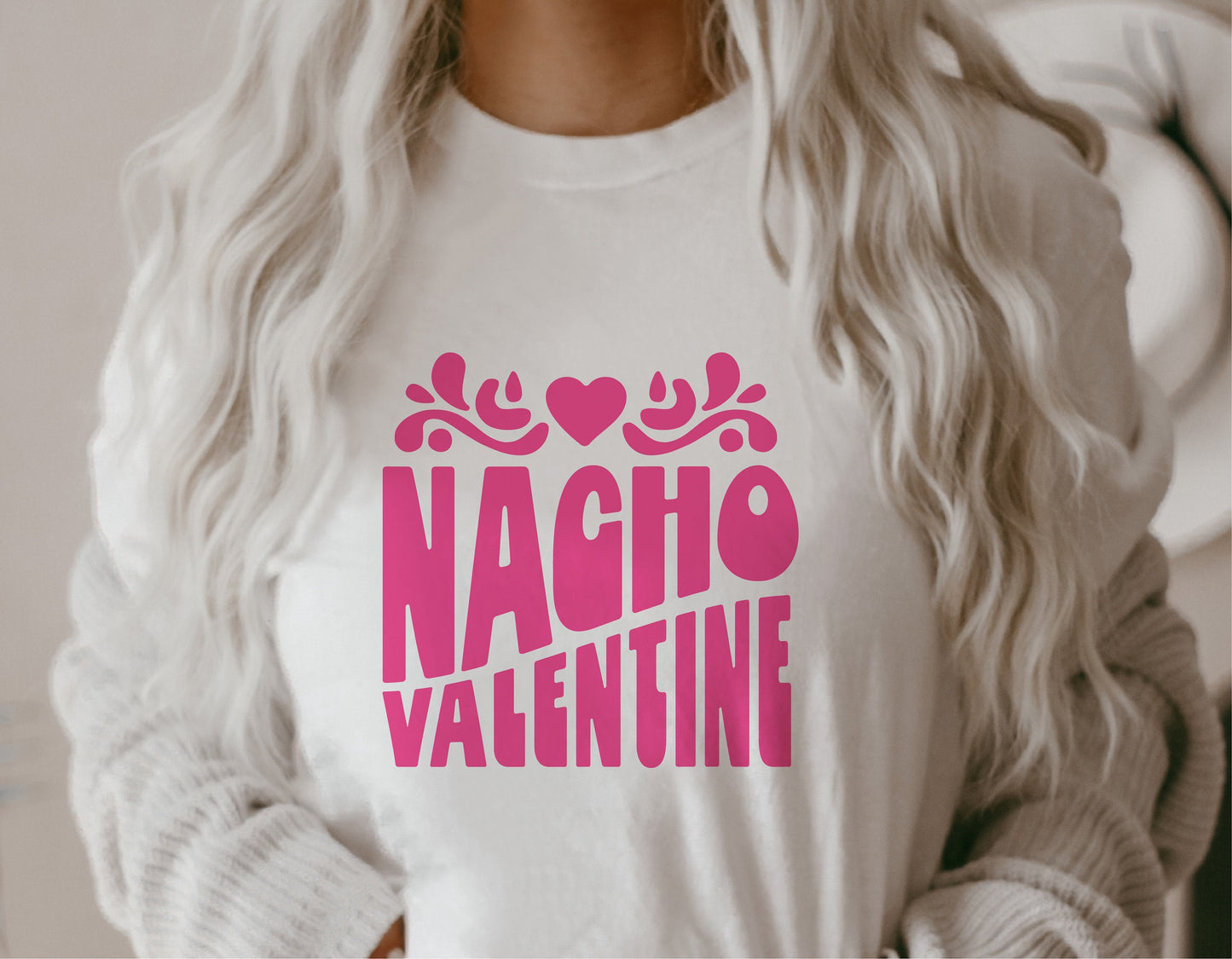 Woman wearing white t-shirt with pink 'Nacho Valentine' design, perfect for DIY Valentine's Day projects using Cricut or Silhouette.