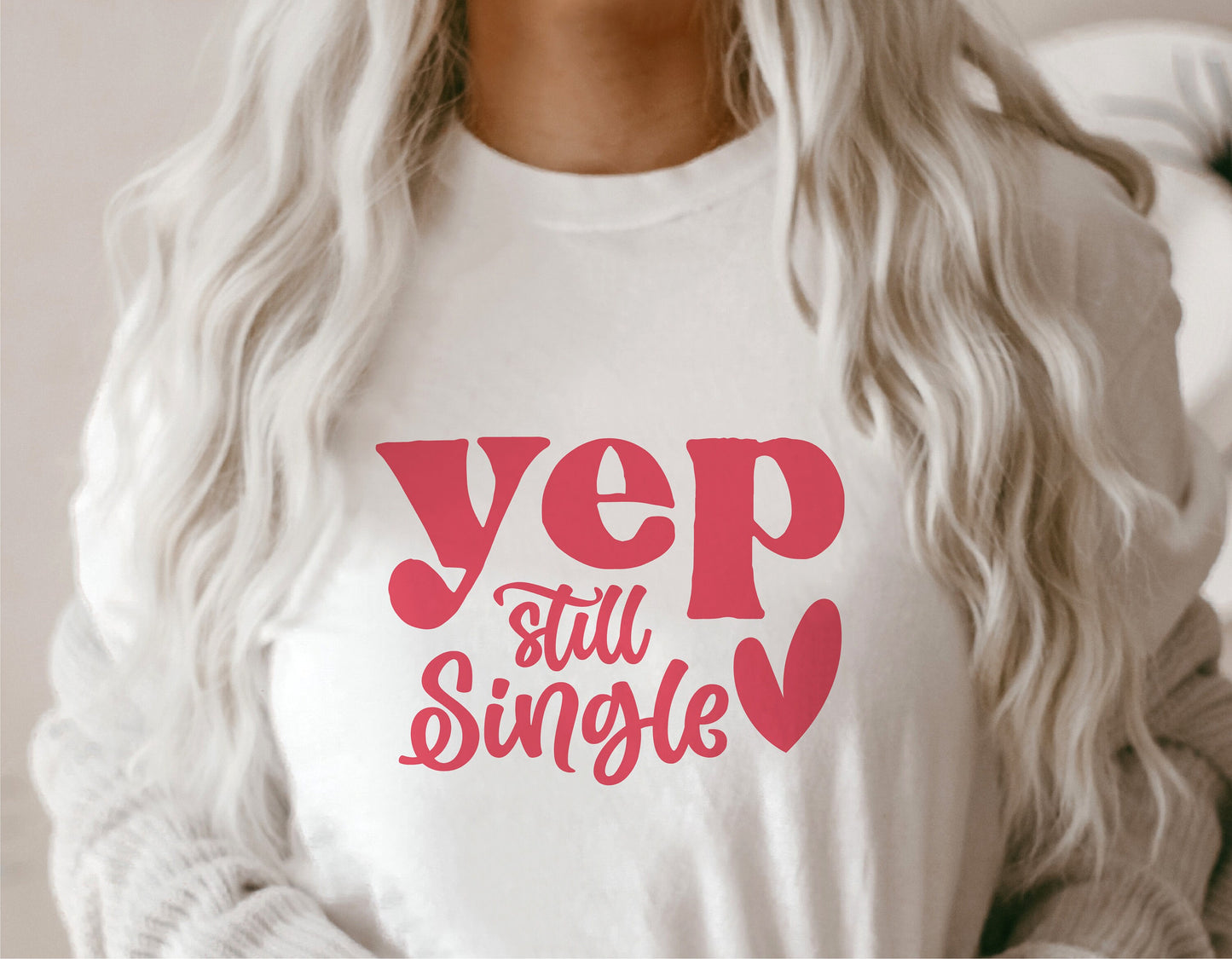 White t-shirt featuring the phrase 'Yep Still Single' in pink, designed for Valentine's Day, perfect for Cricut and Silhouette crafting projects.