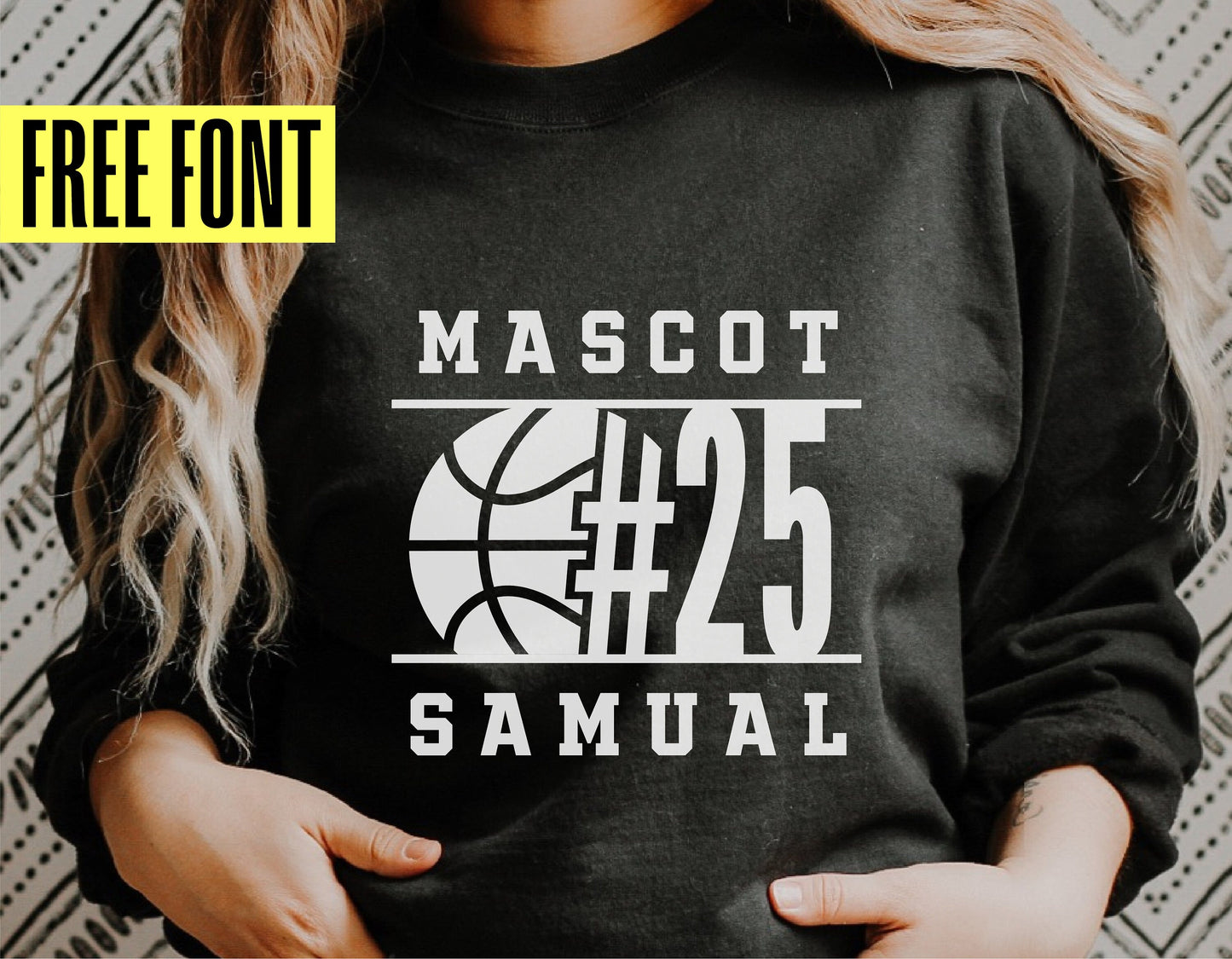 Person wearing a black shirt with basketball-themed design featuring the word 'Mascot' and number 25 with free font offer.