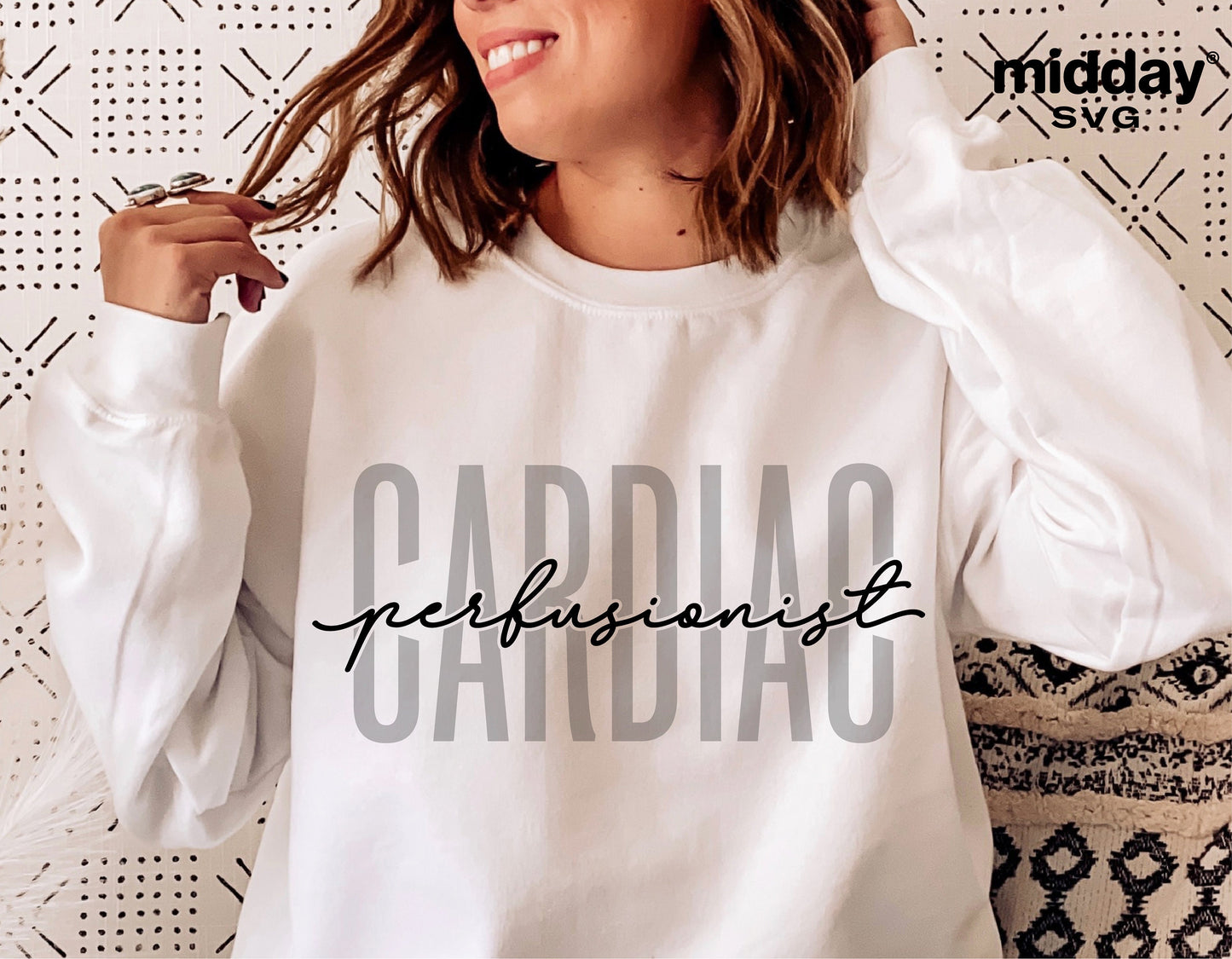 Woman wearing a white sweatshirt with 'Cardiac Perfusionist' text design, suitable for Cricut and Silhouette projects.