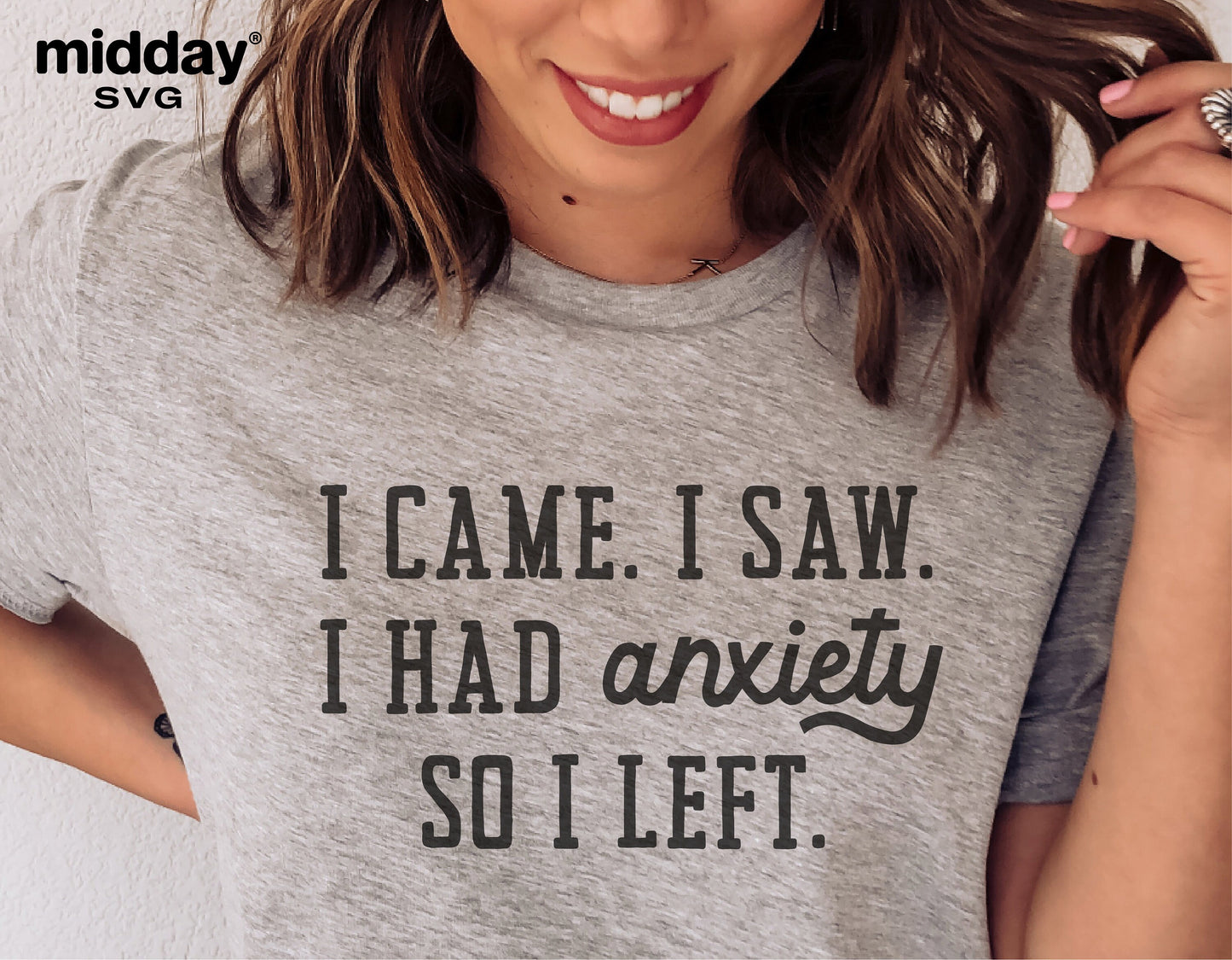 Woman wearing a gray t-shirt with the quote 'I Came. I Saw. I Had Anxiety So I Left.' printed on it.