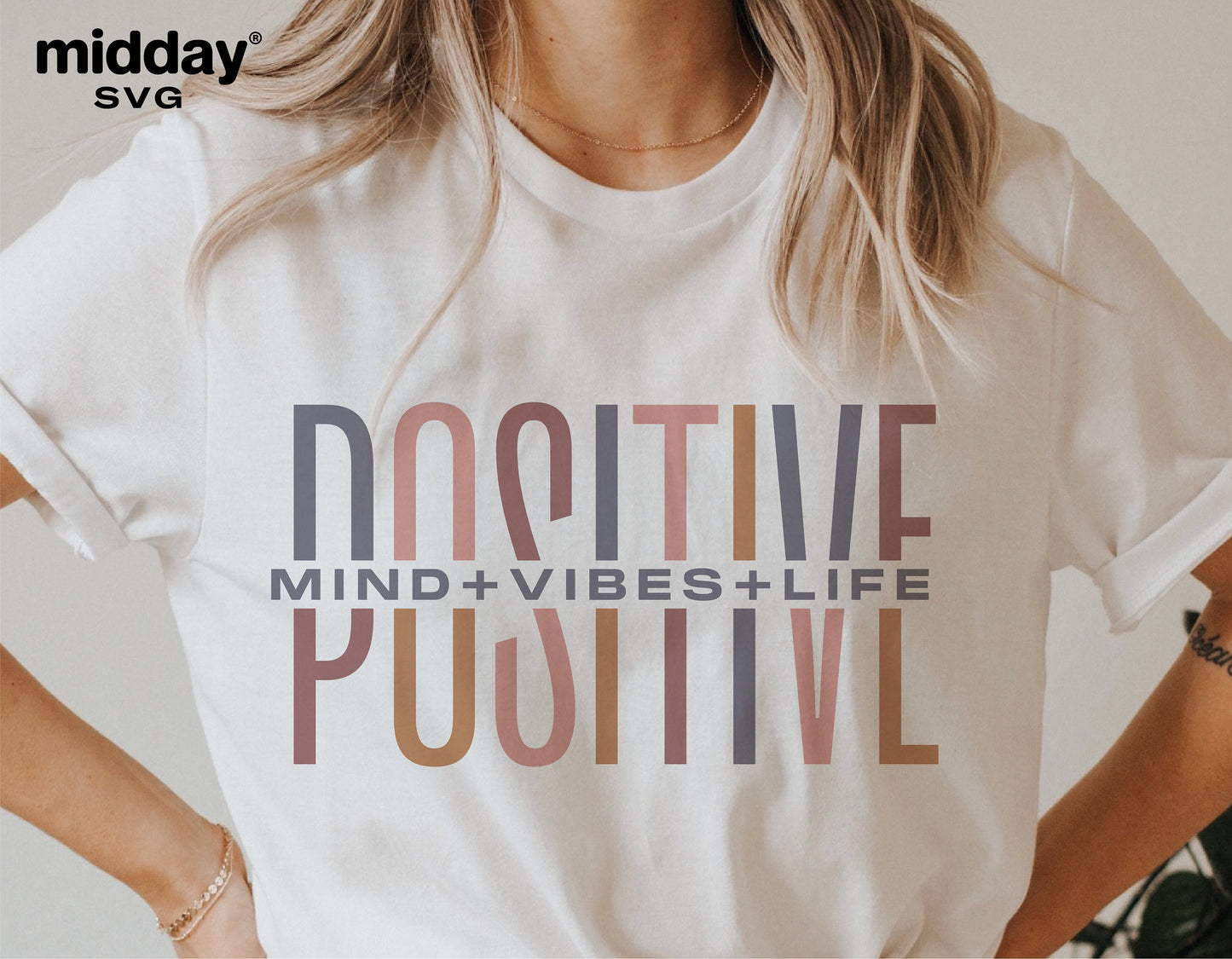 White t-shirt with 'Positive Mind Vibes Life' text design in minimalist style.