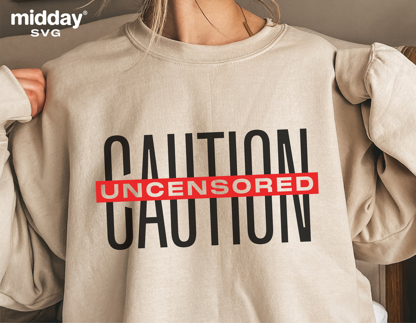 Woman wearing a beige sweatshirt with bold 'Caution Uncensored' print, highlighting funny and sarcastic design for shirts.