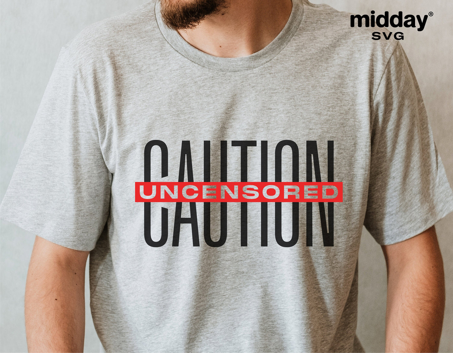 Gray t-shirt with 'Caution Uncensored' text in black and red, worn by a person, showcasing a sarcastic and humorous design.