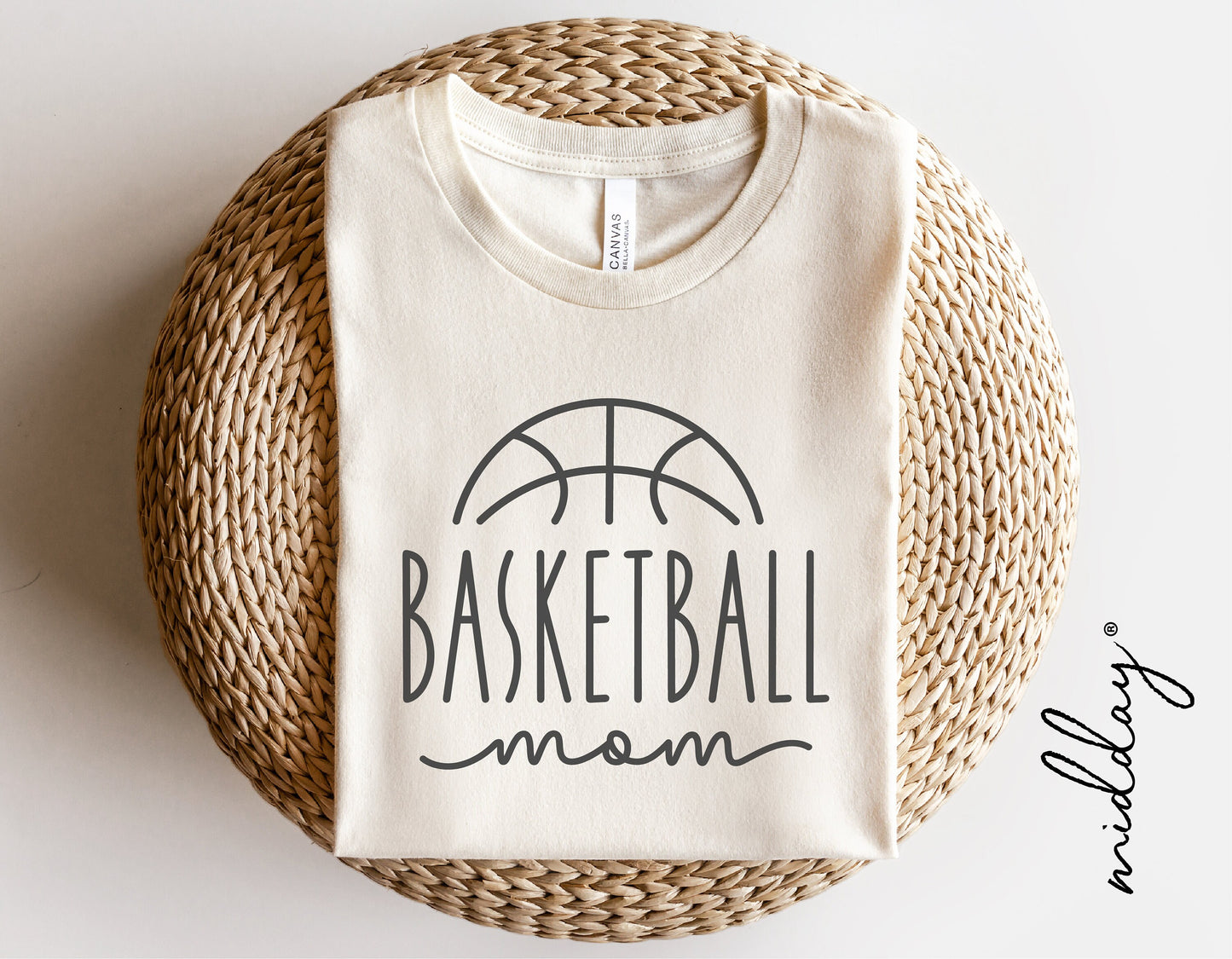 Basketball Mom shirt design displayed on woven basket, ideal for SVG, PNG download for Cricut, sublimation, and personalized apparel.