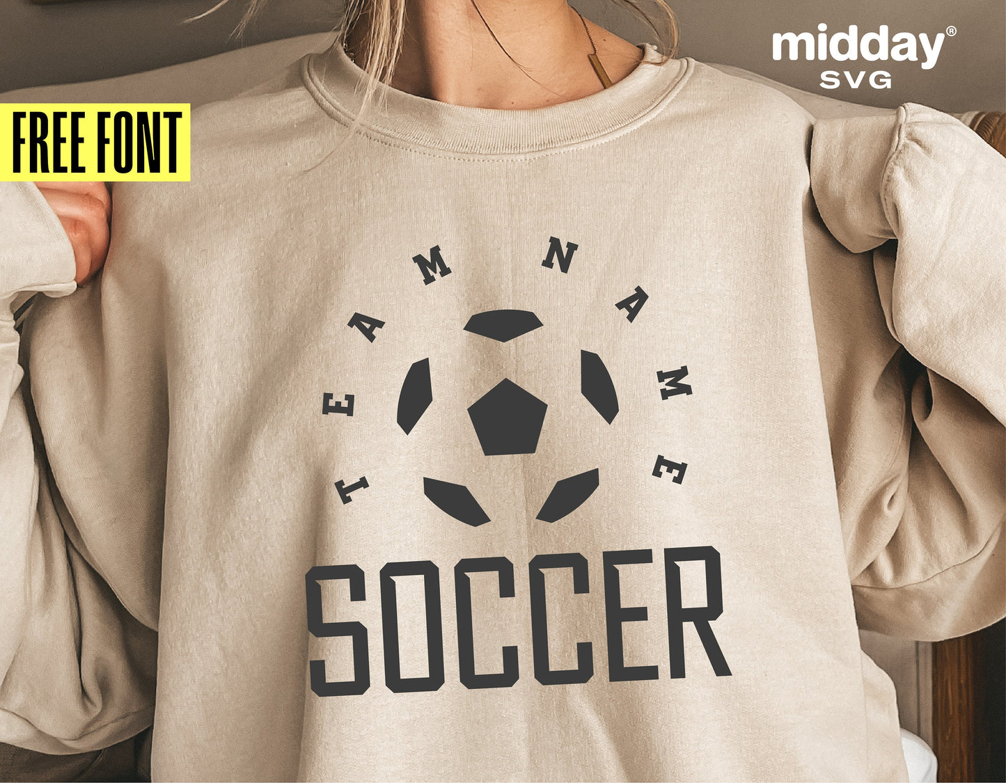 Beige sweatshirt with custom soccer team SVG design featuring a soccer ball and text, ideal for Cricut and Silhouette projects. Free font included.