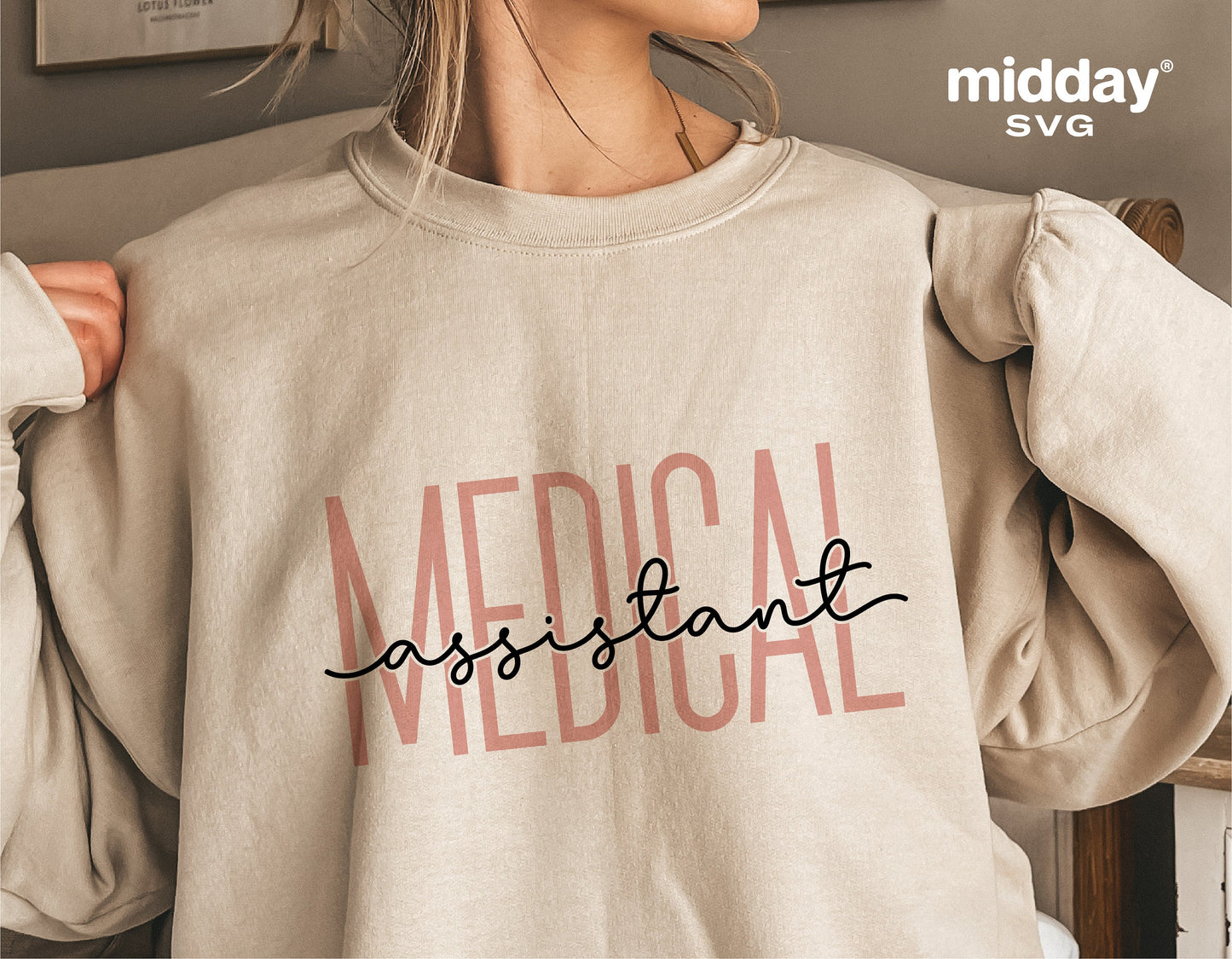 Woman wearing a beige sweatshirt with 'Medical Assistant' text design, suitable for Cricut and Silhouette crafting projects.