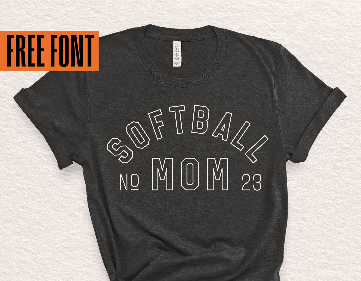 Black t-shirt with 'Softball Mom 23' design, highlighting free font offer.