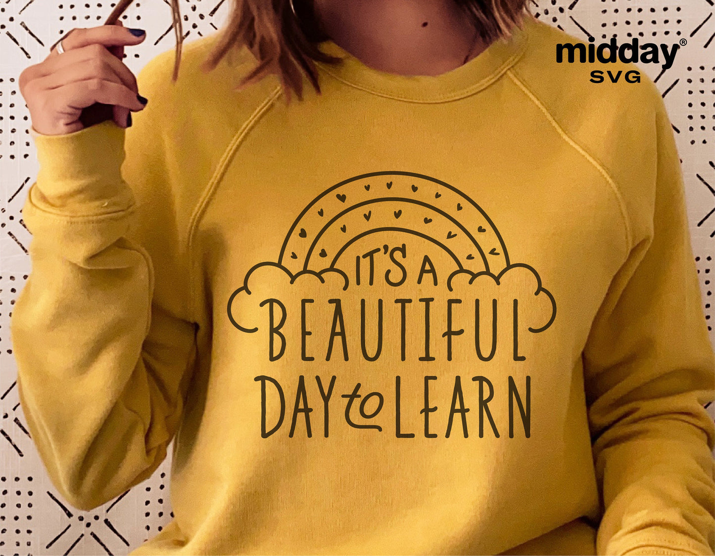 Yellow sweatshirt with 'It's a Beautiful Day to Learn' SVG design, ideal for teachers, compatible with Cricut and Silhouette.