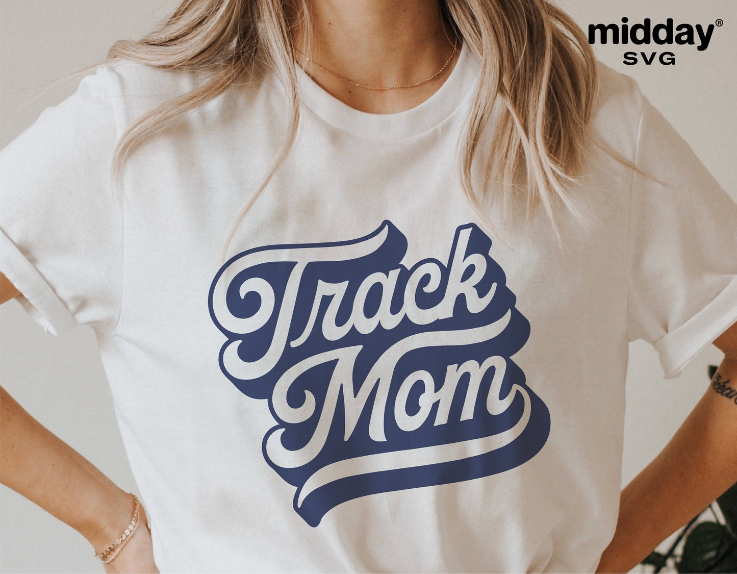 White t-shirt with "Track Mom" design, perfect for sublimation and Cricut projects, featuring sporty style for track enthusiasts.