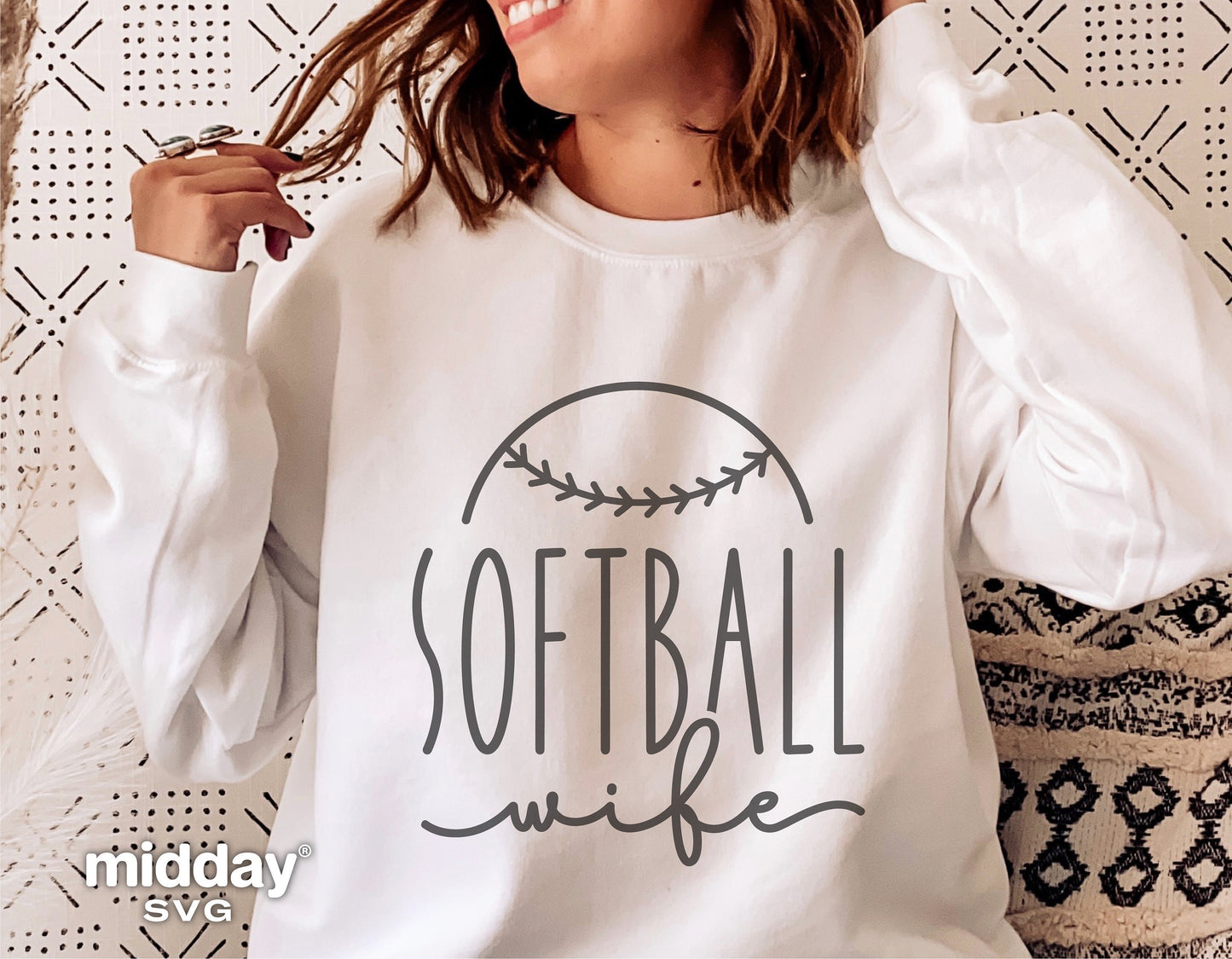 Woman wearing white sweatshirt with 'Softball Wife' design, suitable for Cricut and Silhouette, perfect for softball team lovers.