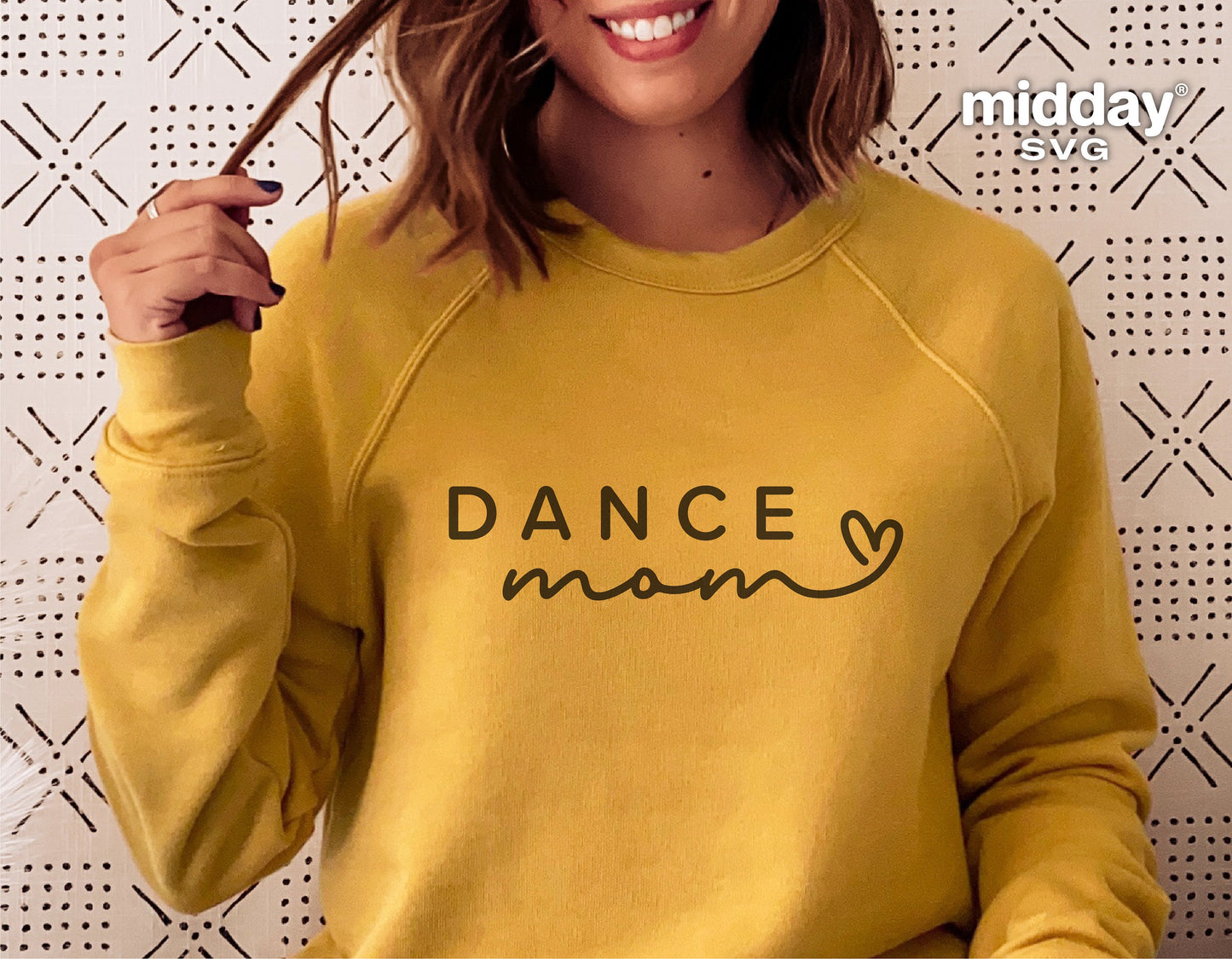 Yellow sweatshirt with 'Dance Mom' text and heart design, ideal for dance enthusiasts, compatible with Cricut and Silhouette machines.