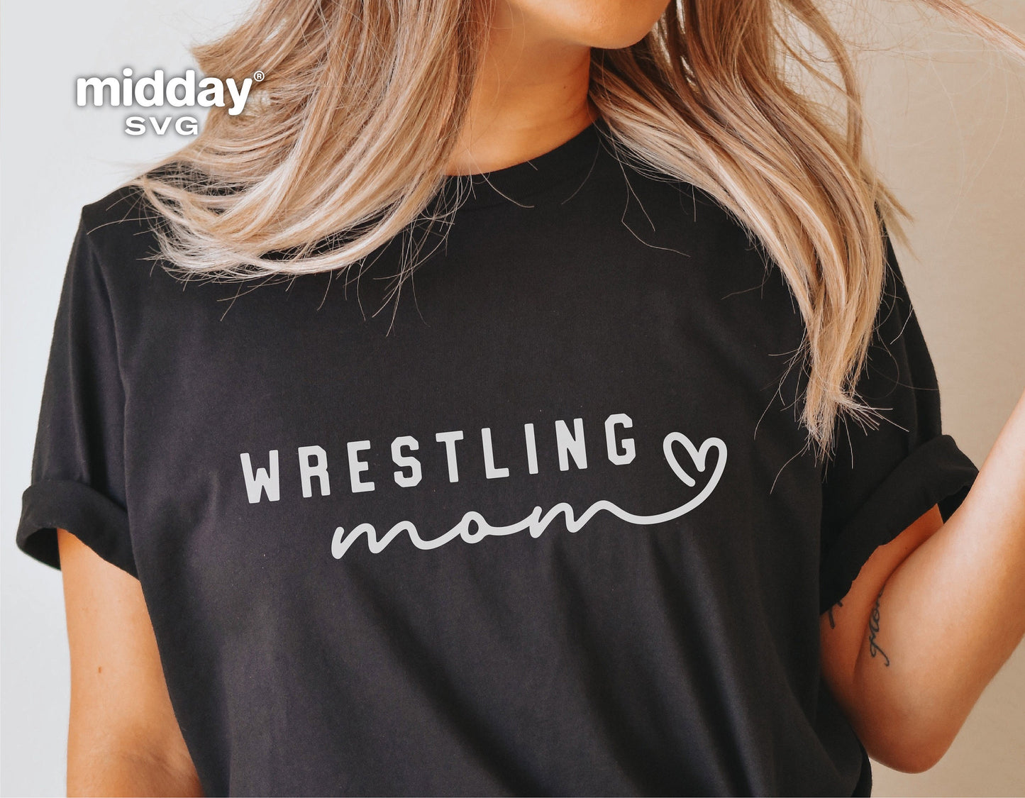 Black t-shirt featuring 'Wrestling Mom' graphic design with heart, ideal for Cricut and Silhouette projects.