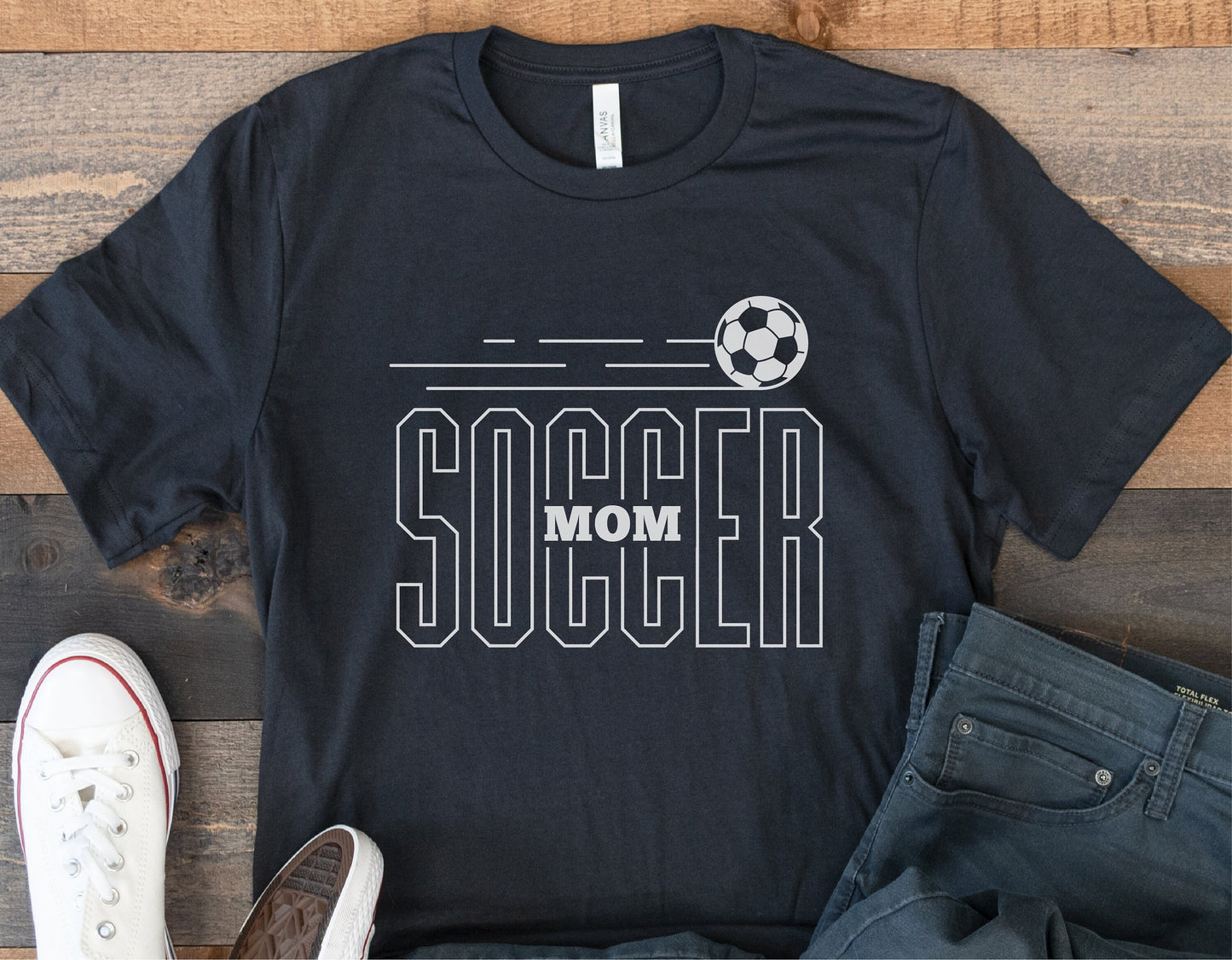Black t-shirt with 'Soccer Mom' design and soccer ball graphic, ideal for sports-themed Cricut and Silhouette projects.