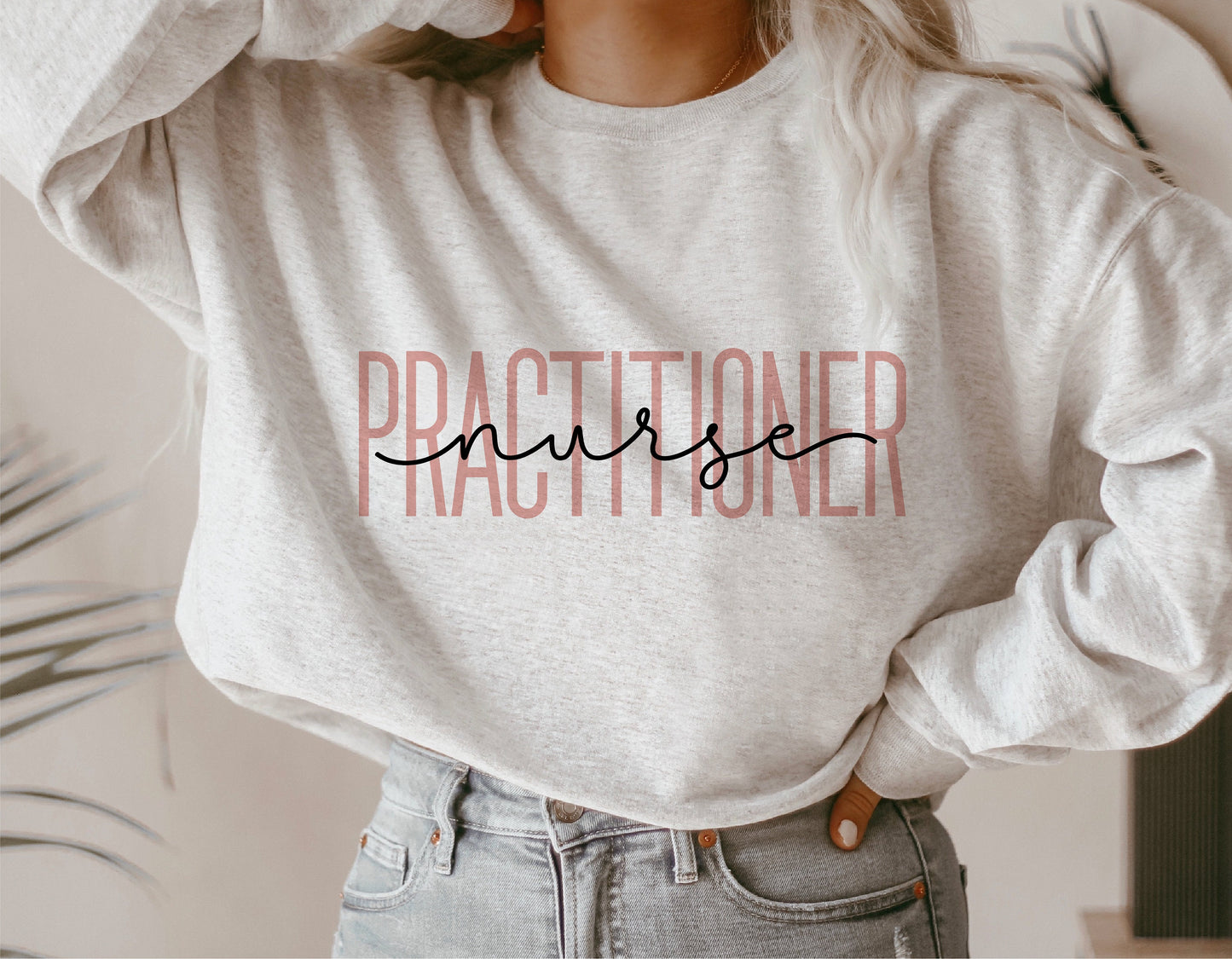 Alt Tag: Person wearing a gray sweatshirt with 'Nurse Practitioner' design, ideal for healthcare professionals, Cricut and Silhouette projects.