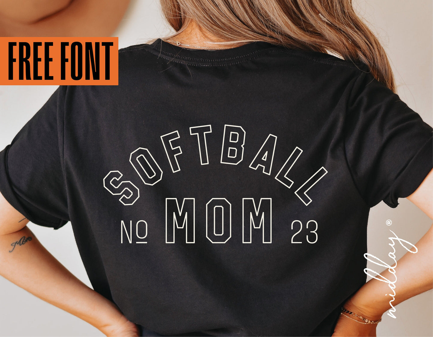 Black Softball Mom shirt with white bold lettering, model wearing the shirt with free font offer displayed.